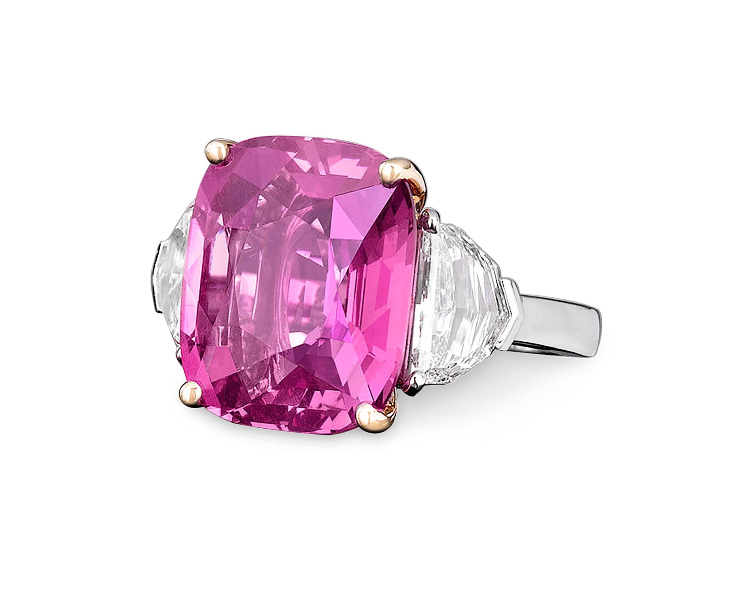 An extraordinarily rare, 16.37-carat Pink Ceylon sapphire takes center stage in this striking ring. Displaying the perfect purplish-pink bubblegum hue for which the finest pink sapphires are so beloved, this enchanting, cushion-shape gem boasts both