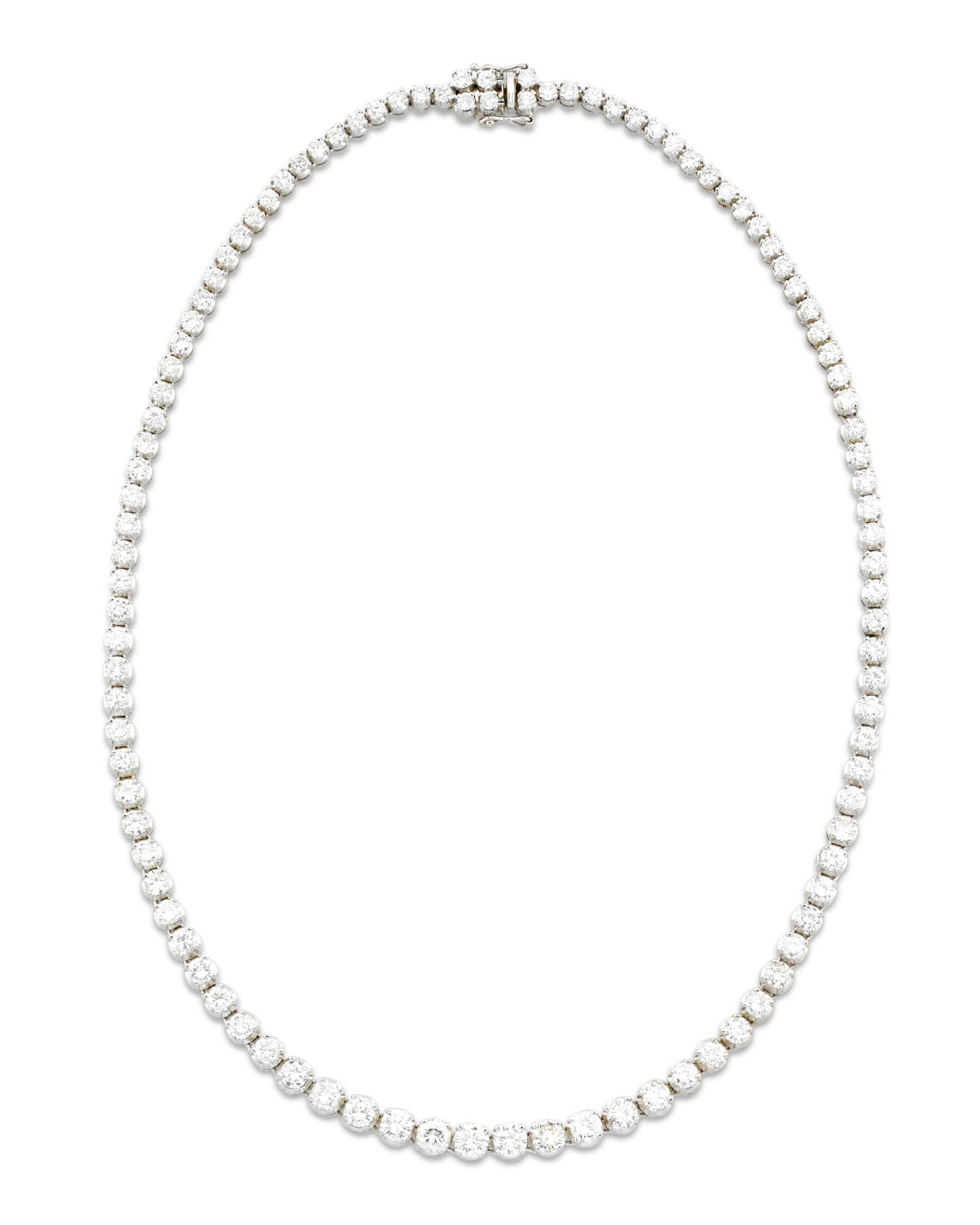 A true classic of diamond creations, this diamond Rivière necklace is absolutely extraordinary in both the exceptional quality of its gems and its sophisticated design. A river of shimmering diamonds totaling 16.50 carats comprise the dazzling