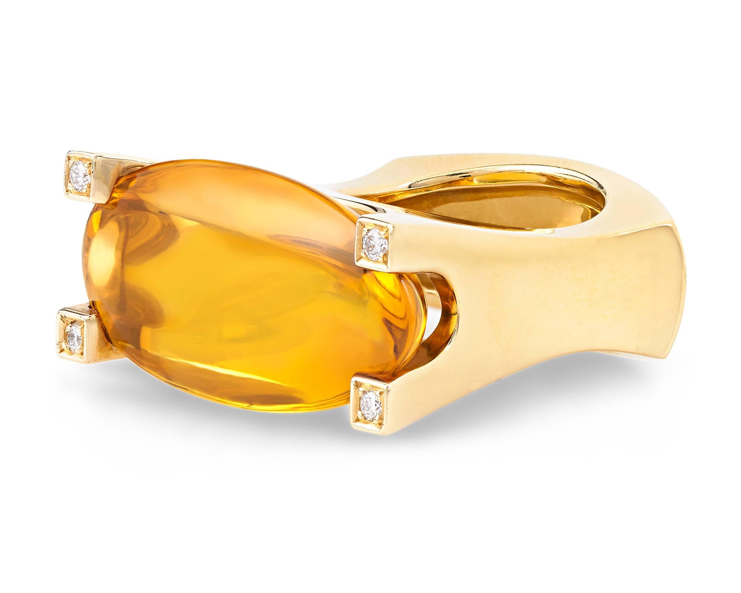 Combining exquisite gems and daring design, this ring by Van Cleef & Arpels is a standout example of retro cocktail jewelry. The bold 18K yellow gold form features a monumental golden citrine totaling approximately 35 carats, with four white