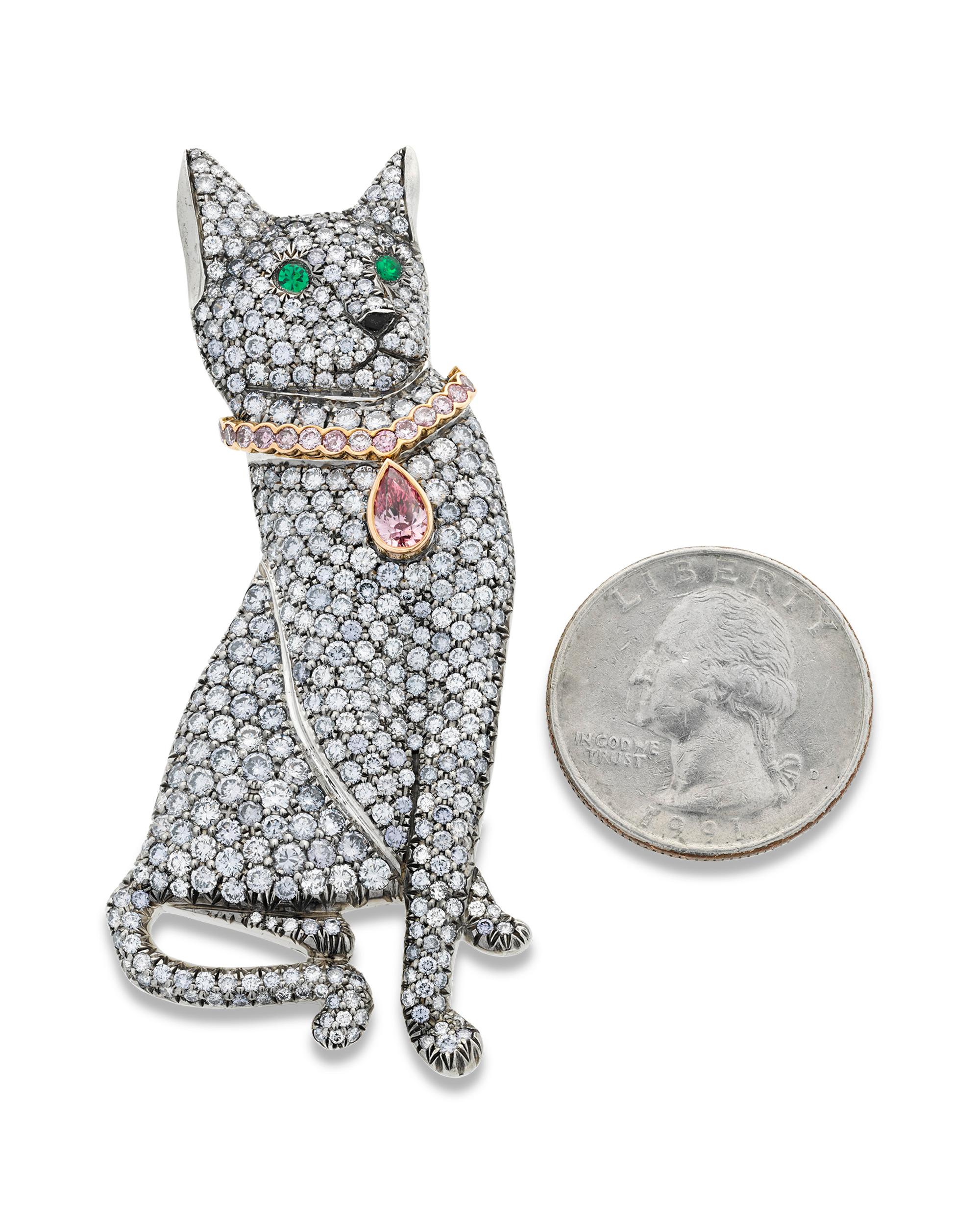 An array of colored diamonds bring this exquisite cat brooch to life. Inspired by the popular Russian Blue cat breed, the charming piece is set with a remarkable 7.51 total carats of rare light blue diamonds that perfectly mimic the cat's pale