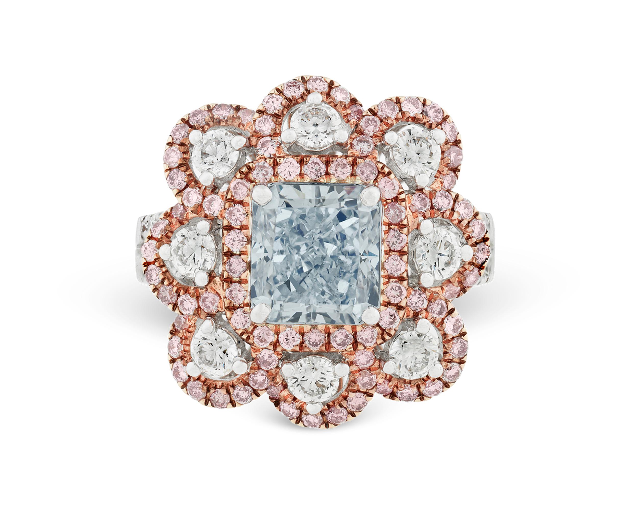 A rare 2.36-carat fancy very light blue diamond captivates the eye in this enchanting ring. Diamonds with a blue hue are among the most coveted of all colored diamonds, prized for both their rarity and beauty. The delicate hue of this blue diamond