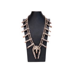 Collier vintage Navajo en argent massif avec corail, motif « Squash Blossom »