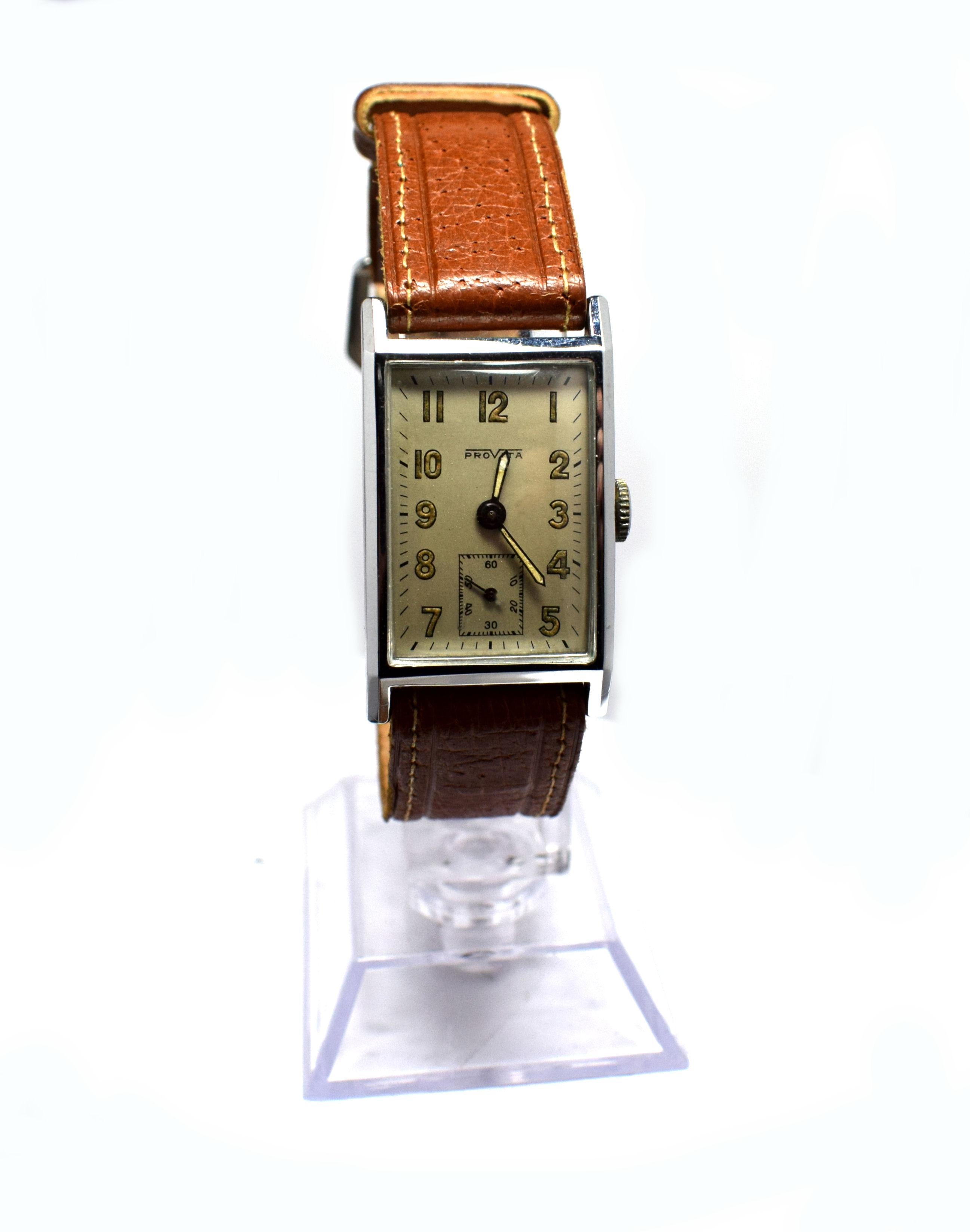 For your consideration is this very stylish Art Deco 1930's men's tank watch made by Provita a Swiss company. Beautiful condition through out, the chrome is as good as you could hope for. The dial shows little to no signs of it's age. Has a sweeping