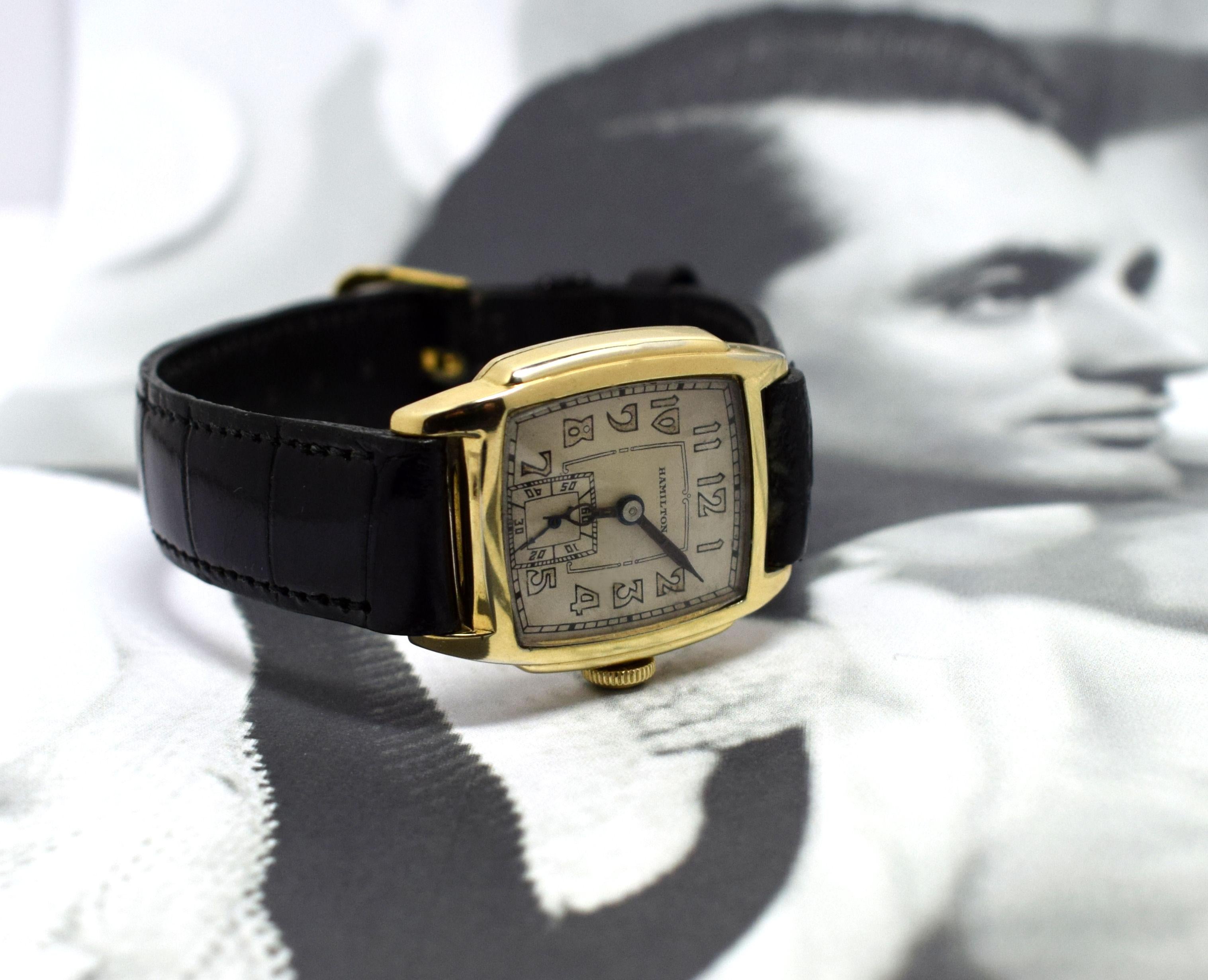 Extremely stylish Art Deco American gents wrist watch dating to 1933 and made by Hamilton Watchmakers.  This model was produced from 1933 to 1937. Wonderful yellow gold stepped tonneau case which is in exceptional condition for it's age, free from