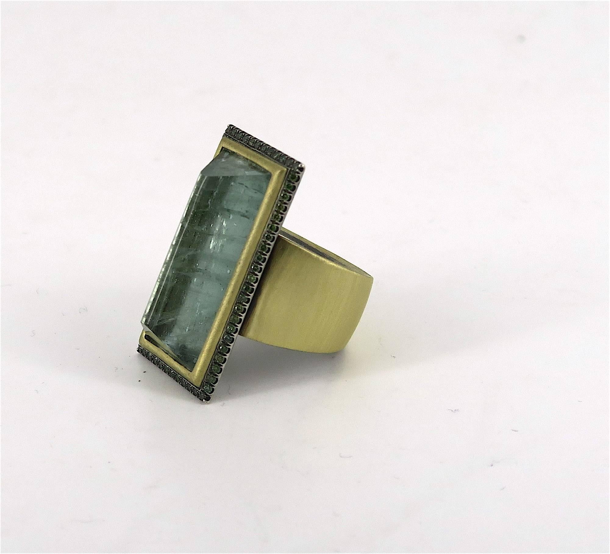 The centerpiece of this statement ring is 17.19 carats of a beautiful sea green variety of Beryl. Embodying the spirit of the ocean, green crystal Beryl radiates calm and peace to its owner. Gaze into the stone and you will be transported to serene