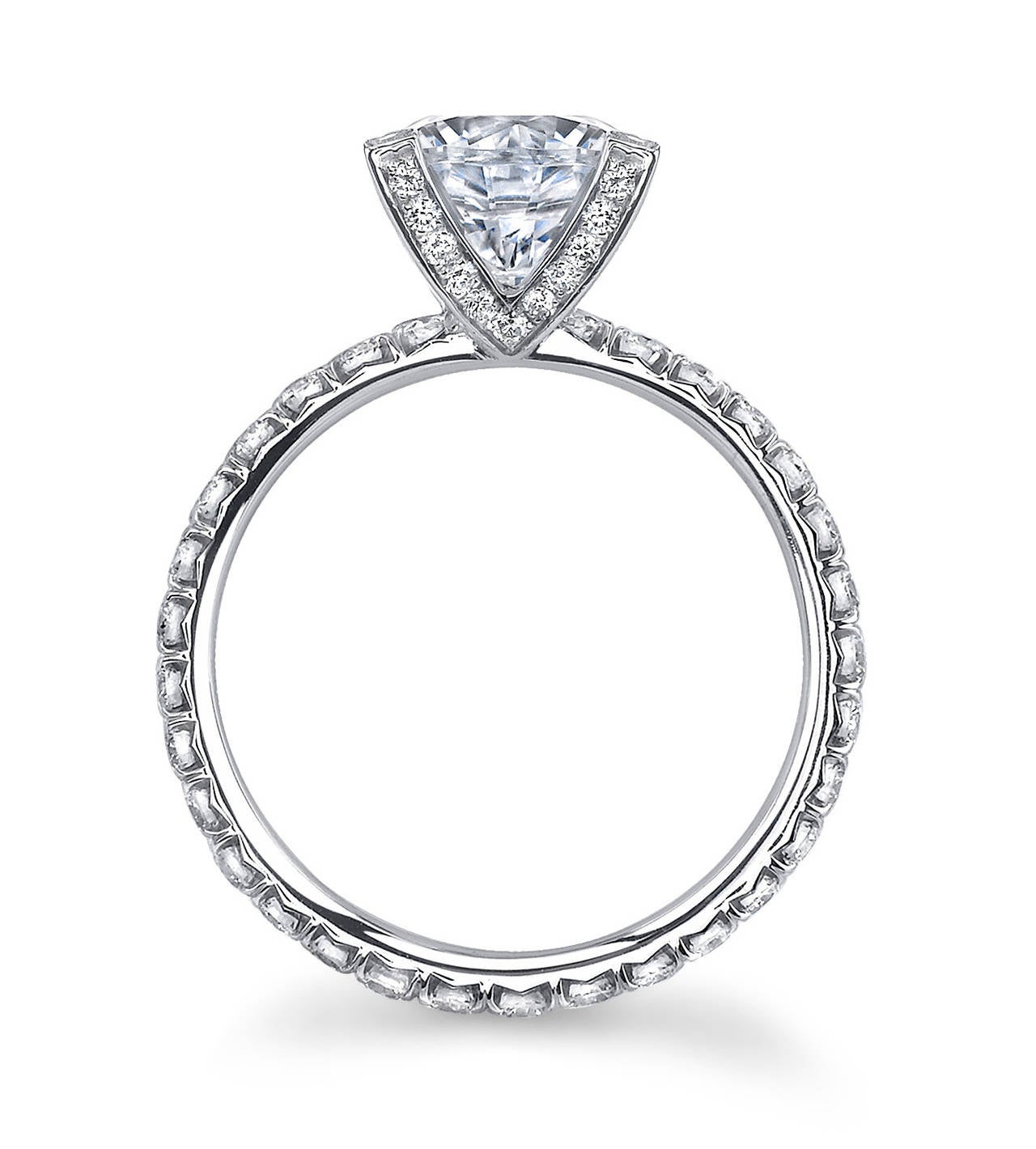 Platinum "SV French" Ring with a Round Brilliant Center Stone and Ideal Cut Micro Pave Diamonds. Ideal Cut Diamond Qualtiy F/VS2 with a Total Weight of 0.77CT. 

The French have a saying - "Il n'est rien de réel que le rêve et