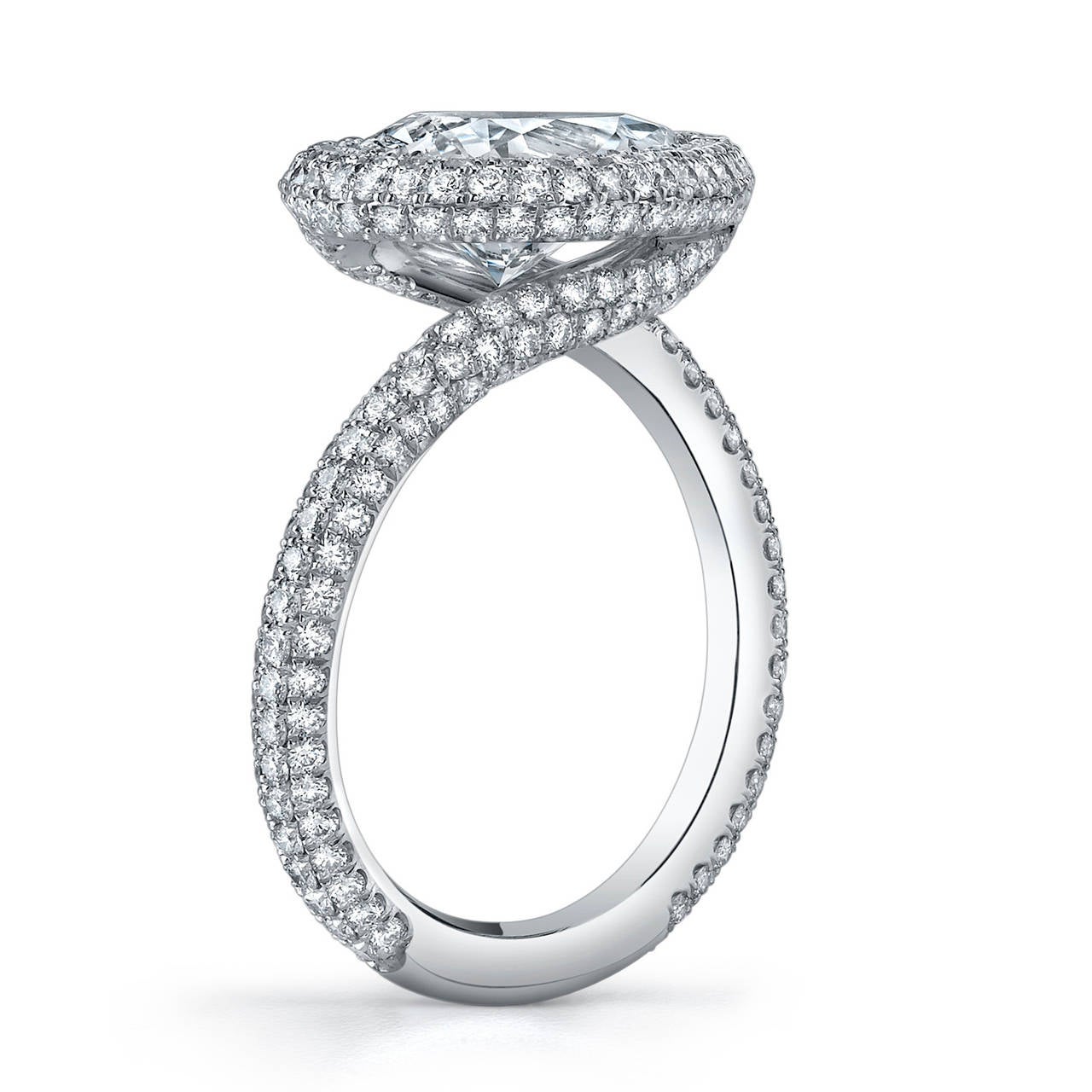 Platinum Diamond Ring with a Pear Shaped Center Stone, accented with Ideal Cut Micro Pave Diamonds.

The sheer elegance and gorgeous curves of this pear shaped mounting are perfect for a unique woman who appreciates sensual design. Women who