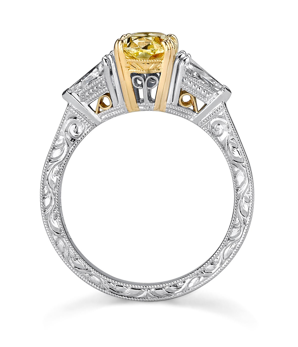 Fancy Oval Canary Yellow Diamond set in Platinum and accented with two .75ct Kite Shaped Side Diamonds. GIA Certified, center diamond, Fancy Yellow 1.18 CT Center Stone.

For centuries, fancy color diamonds have adorned kings and queens from all