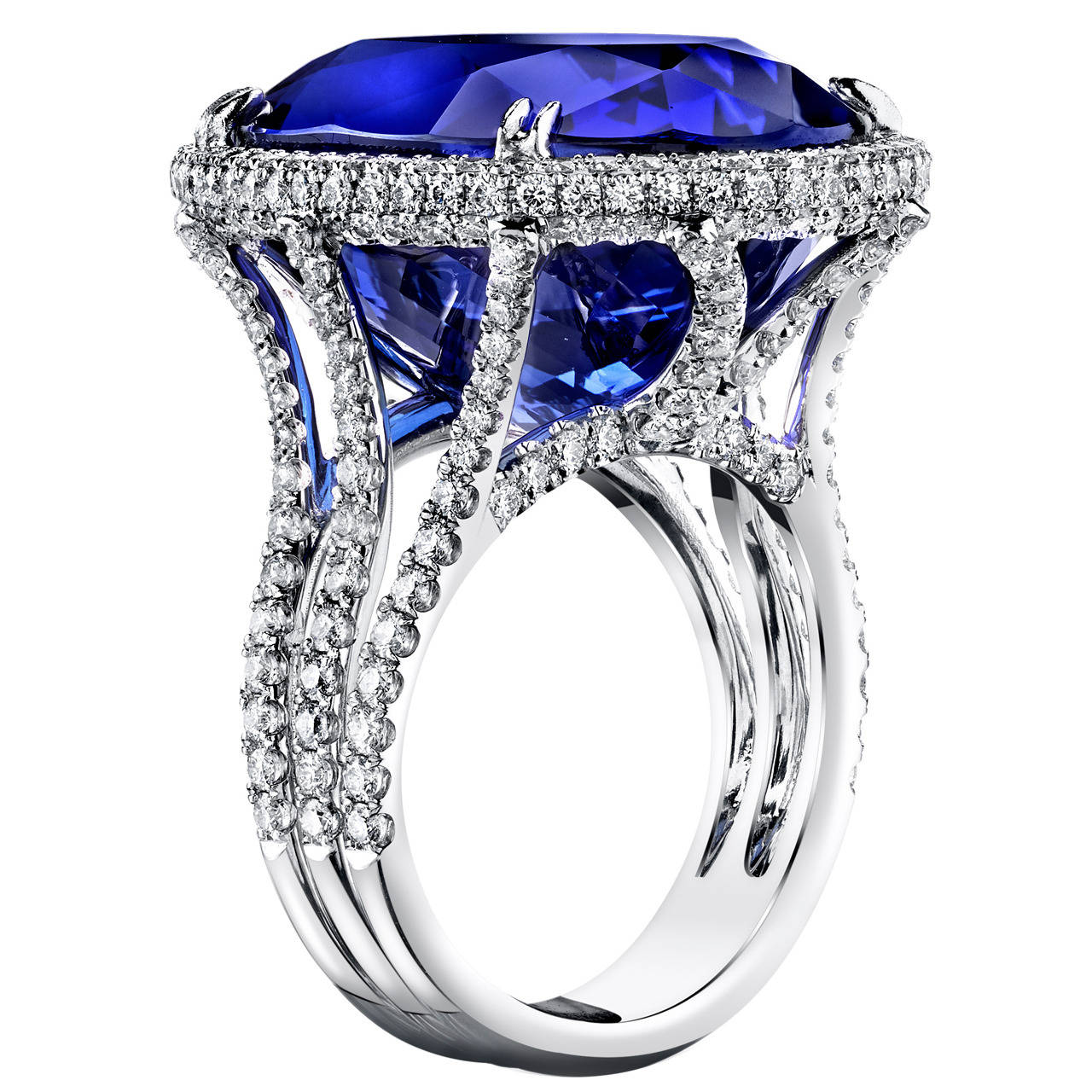 18 Karat White Gold and GIA Certified 32.60 CT Tanzanite Ring, accented with 1.5 CT Ideal Cut F/VS2 Diamonds.

Over 585 million years old, Tanzanite has recently gained popularity and was quick to establish itself as a prized collector's item.