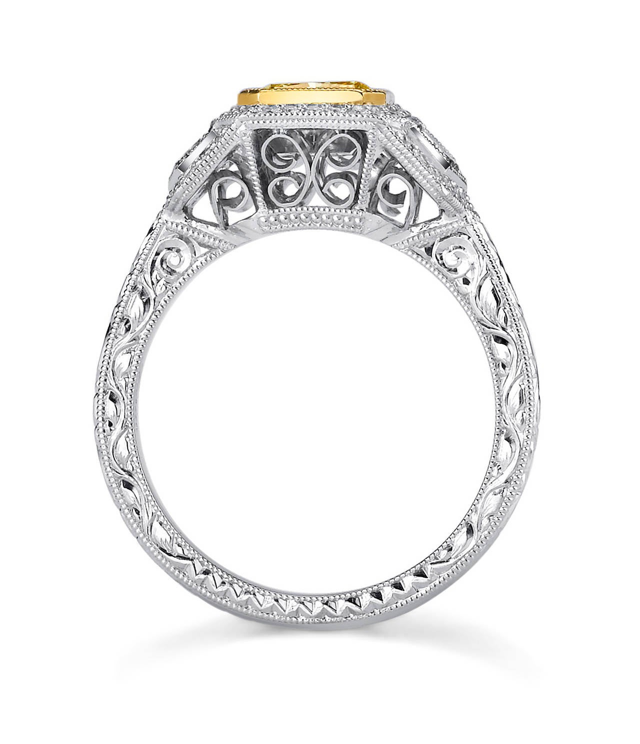 This stunning ring has 1.11 CT (GIA certified) square modified Brilliant Yellow Diamond framed in 18 Karat Yellow Gold. The center stone is accented with 0.65 CT Trapezoid Side Diamonds and 0.60 CT White and Vivid Yellow Diamonds.

The band of