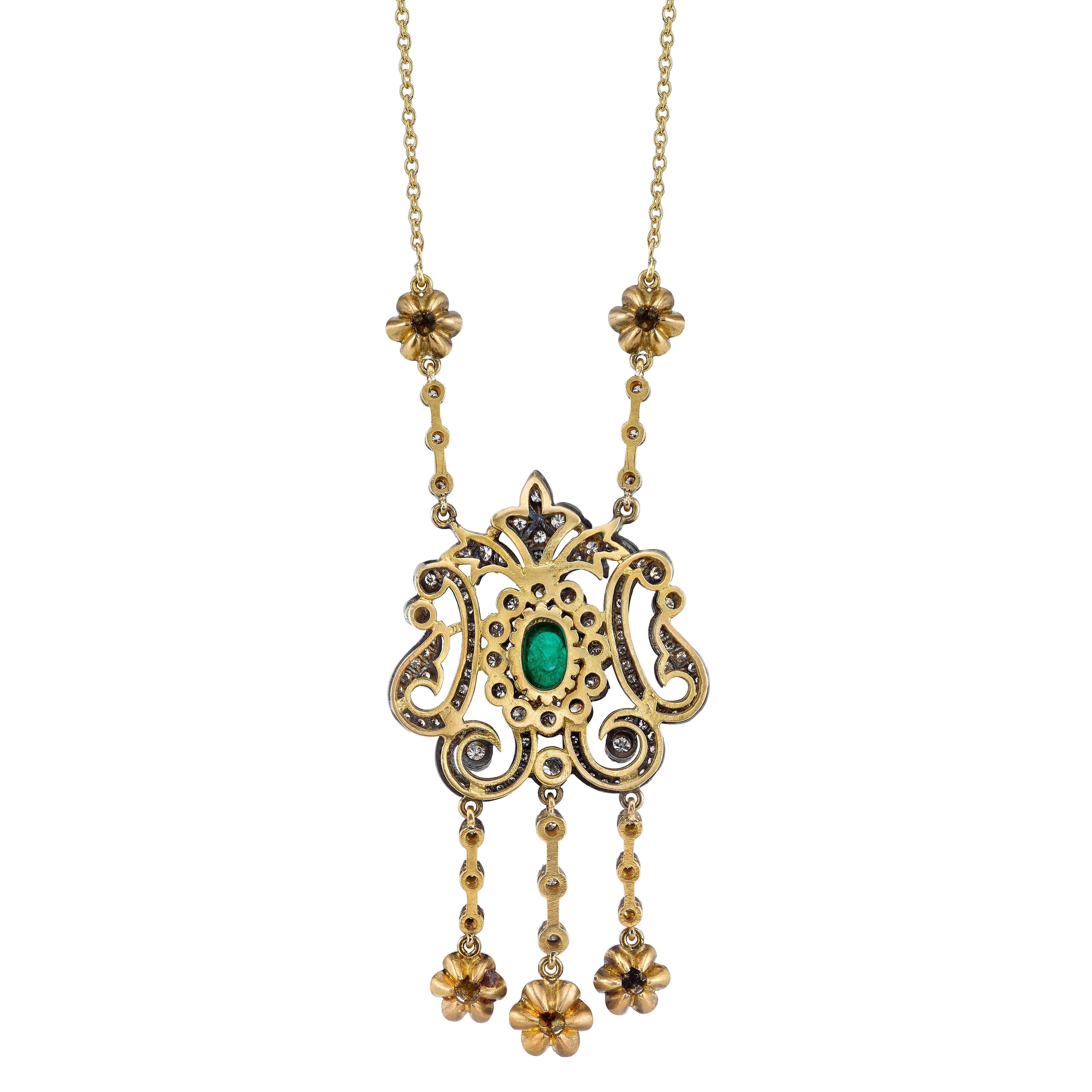 18 Karat Yellow Gold, 1.14 CT Center Oval Cabochon Emerald, 2.22 CT Round Brilliant and Rose Cut Diamonds, and Silver Patina. 

Inspired by the Edwardian Era, a time when fine jewelry was a crucial component of every outfit, pieces were created to