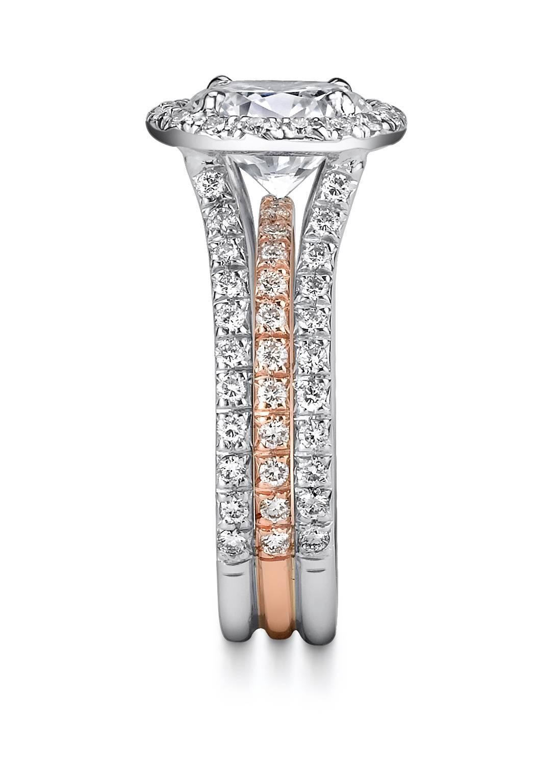 Platinum and 18 Karat Rose Gold Diamond Semi-Mount with a CZ Center Stone Supported by a Triple Row of Micro Pave Ideal Cut Diamonds. Ideal Cut Diamond Quality E/VS2 with a Total Weight of 1.17CT. 

Please note, our price here reflects the