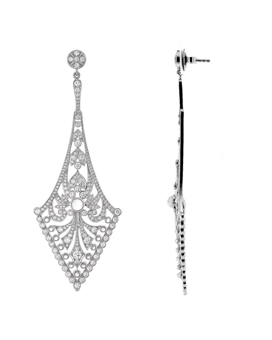 This pair of 18k white gold earrings bring back art deco glamour. Created with timeless sophistication, they feature nearly one carat of natural moonstones per side and sparkling white VVS diamonds totalling 4.2 carats. 

These earrings were