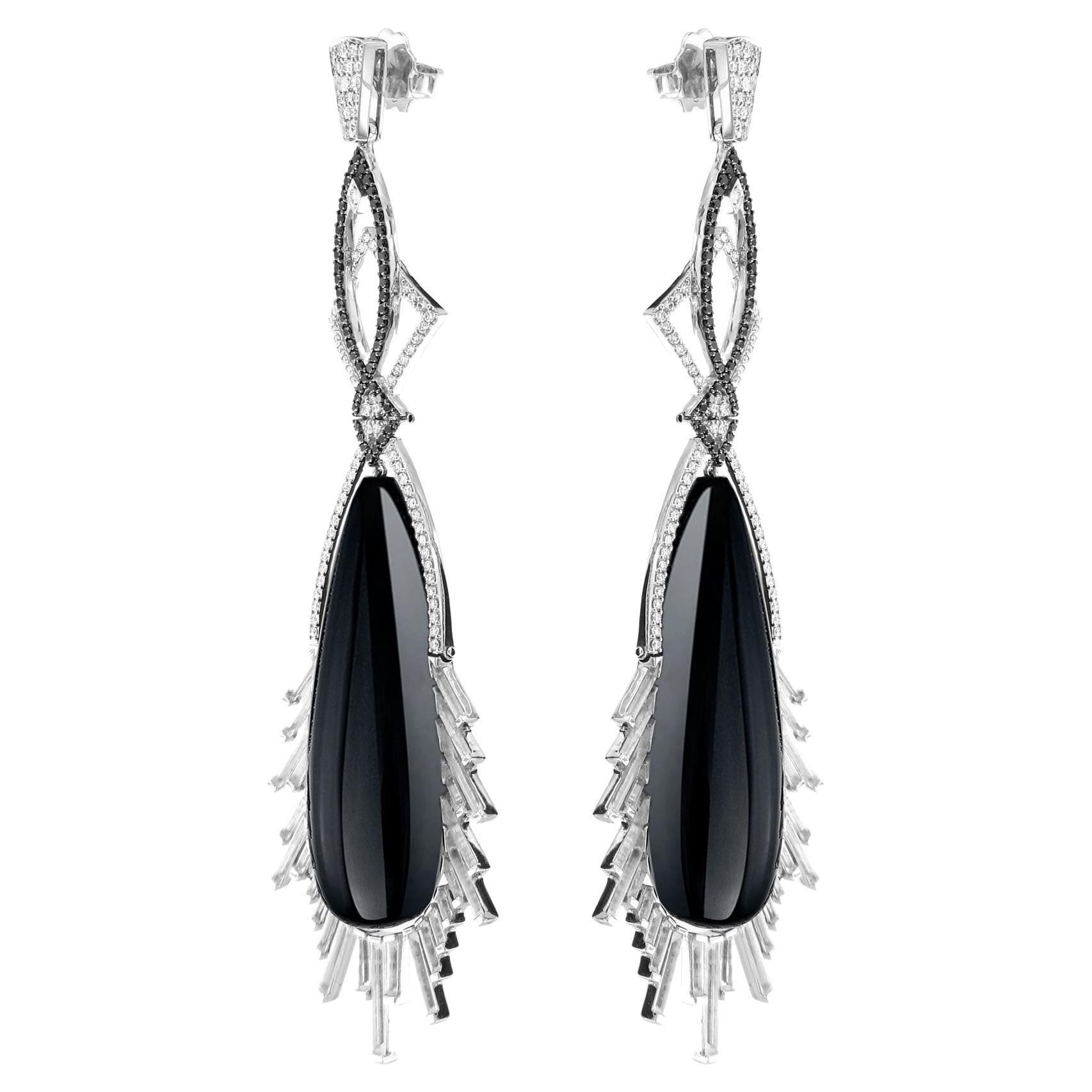 An impressive 88.54 carats of custom made black onyx make this a striking pair of 18k white gold earrings. Carefully carved rock crystal combine with black and white diamonds to make quite the statement.

Our products use natural F VVS diamonds for