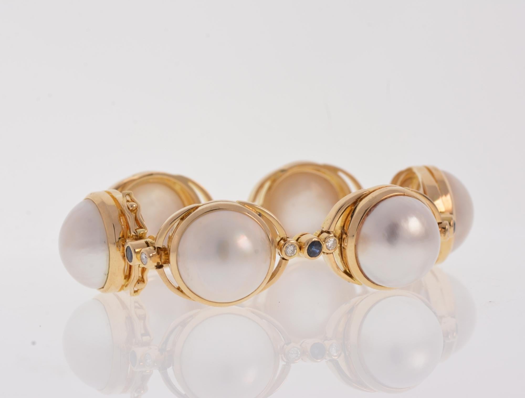 Mother of Pearl Bracelet 18k Yellow Gold with Diamonds & Sapphires 50.70 grams

Main Stone:
Mother of Pearl
Metal:
18k Yellow Gold
Secondary Stones:
Diamonds   .50tcw
Sapphires
Diamonds Color:
GH
Diamonds Clarity:
SI2-I1
Total Gram
