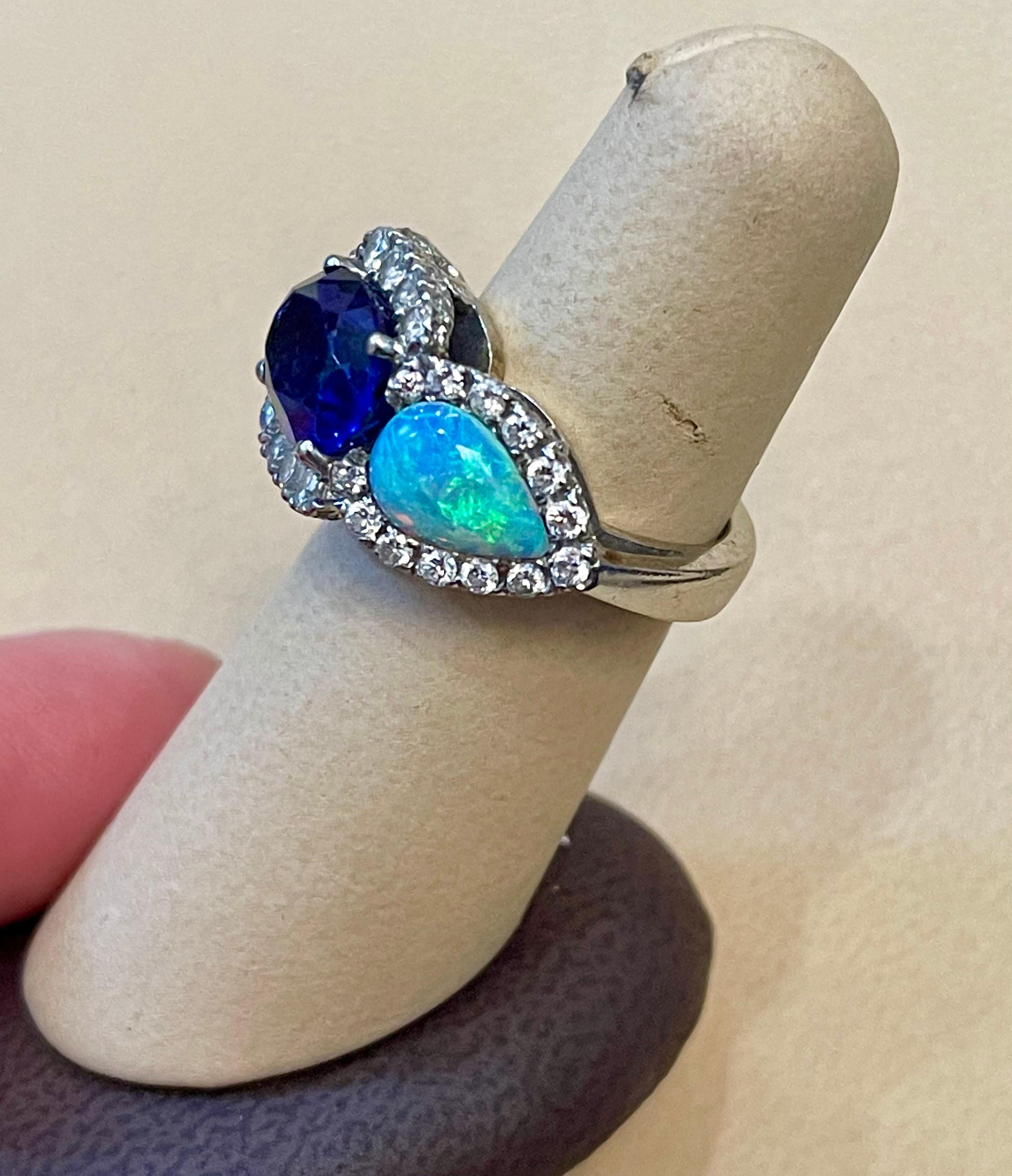 Bague en or blanc 14 carats avec tanzanite ovale de 5 carats, diamant et opale, ancienne propriété en vente 3