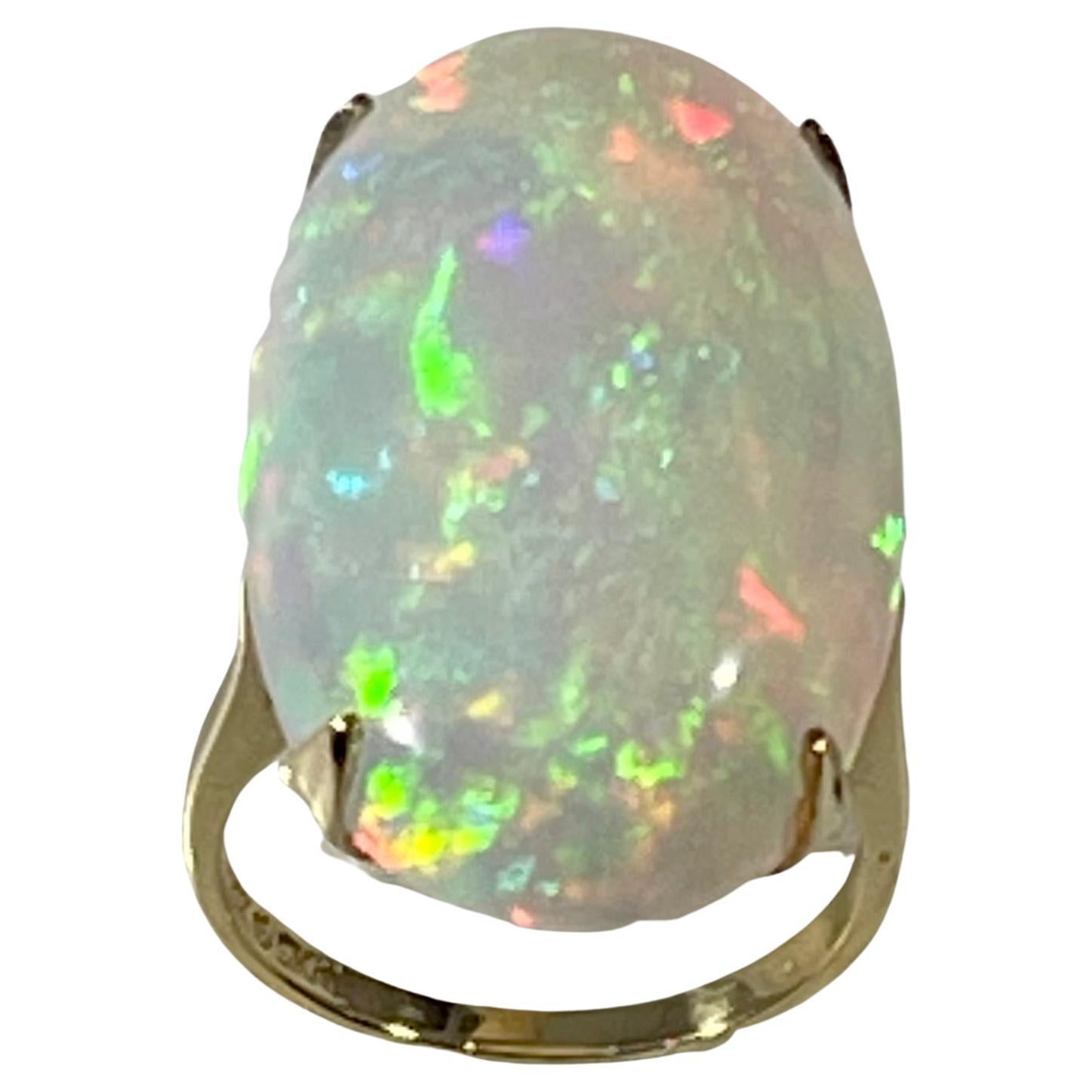 14 Carat Oval Shape Ethiopian Opal Cocktail Ring 14 Karat Yellow Gold For Sale