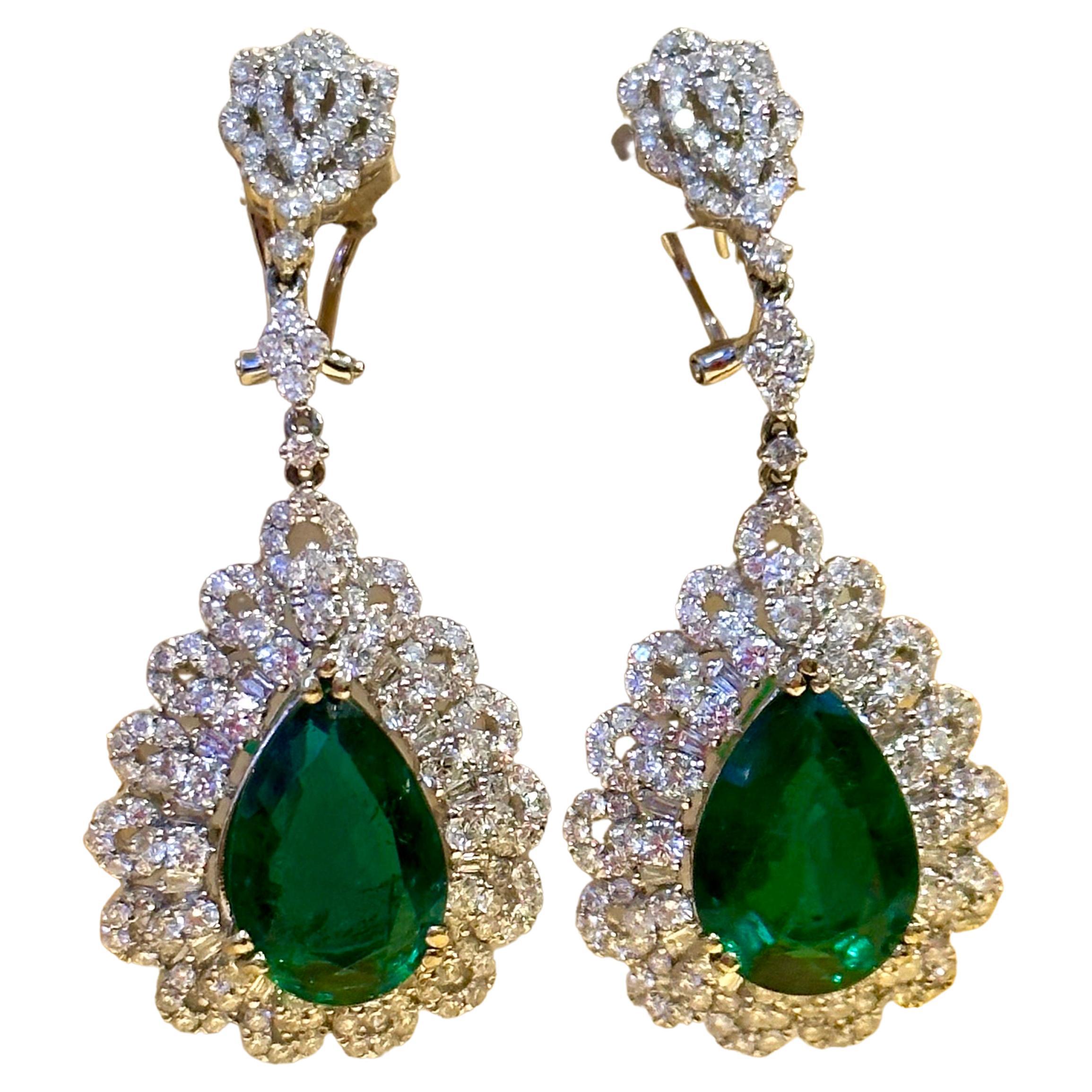 GIA Report # 2221836477
Natural Beryl 
Origin Zambia
14 Ct Pear/Drop Zambian Emerald 7 Ct Diamond Dangling Earrings 18 Kt Gold 
These Earrings are with Perfect pair of matching emeralds and Diamond 
This exquisite pair of earrings are beautifully