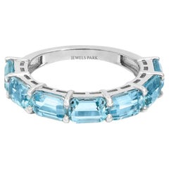 Natural aquamarine half band ring in 18k gold