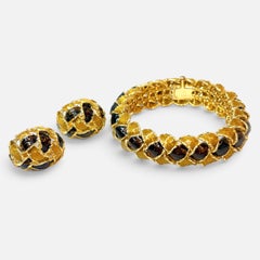 Set di bracciali e orecchini Piaget d'epoca, oro giallo 18 carati e smalto