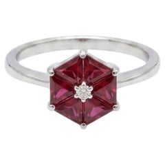 Bague en or 18 carats sertie d'un rubis de 0,66 ct et d'un diamant de 0,02 ct
