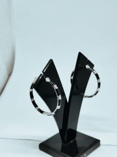 Boucles d'oreilles clous en or 18 carats serties d'un diamant de 0,74 carat, une élégance intemporelle
