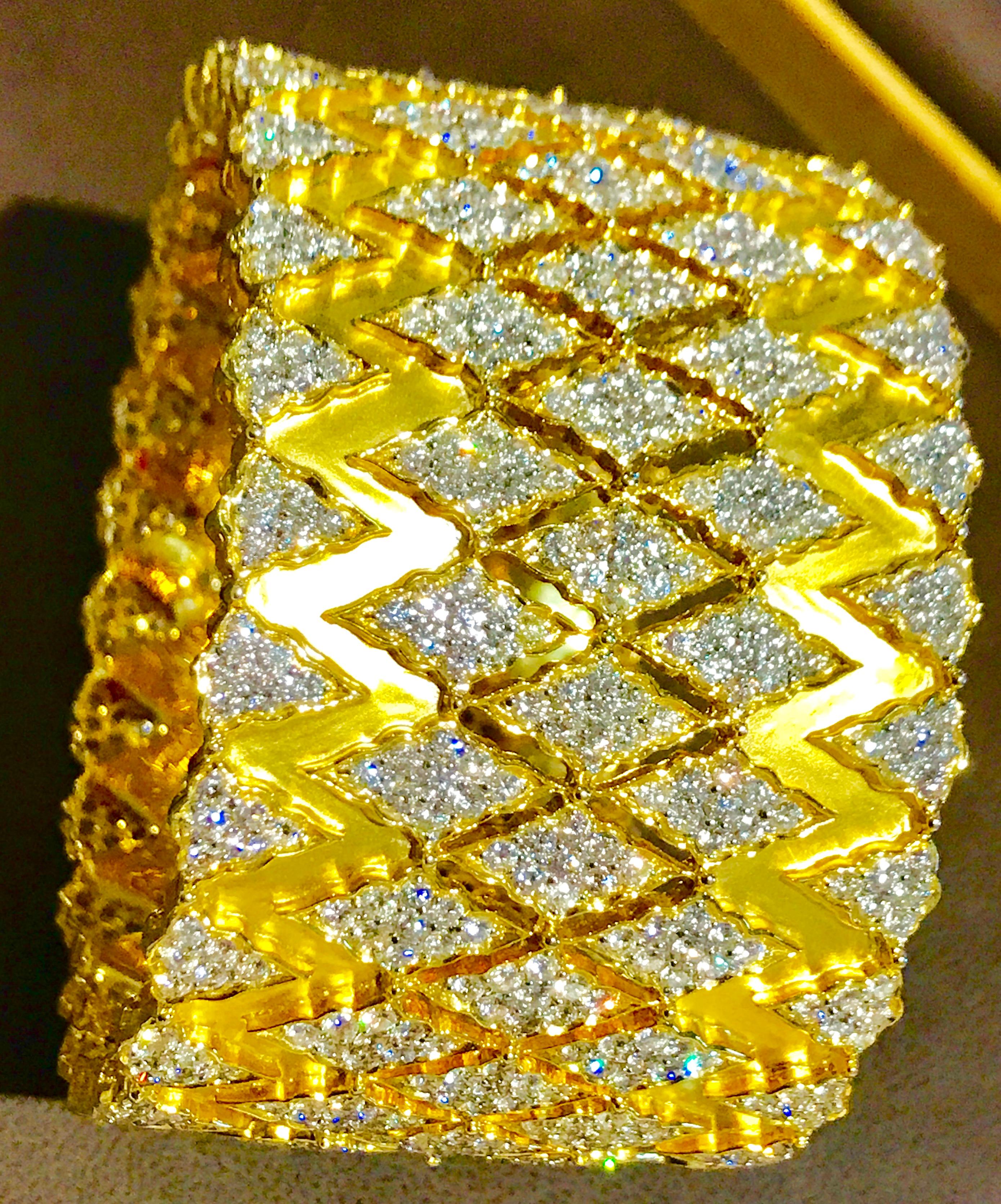 A spectacular jewelry piece from Estate. This exceptional Bangle  has round brilliant cut diamond in the form of   Rhombus .The bangle  is expertly crafted with 173 grams of  18 karat gold  and loaded with 936 round diamonds totaling  approximately