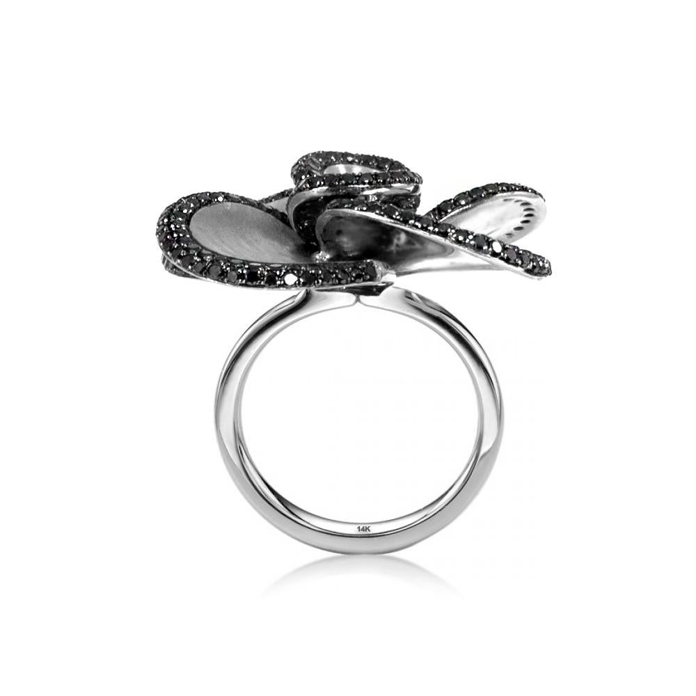 Get noticed with this beautiful floral statement ring with 2.51 carat of exotic black diamonds beautifully created in 14 karat white gold. This ring is in size 7 and if needed it can be resized.