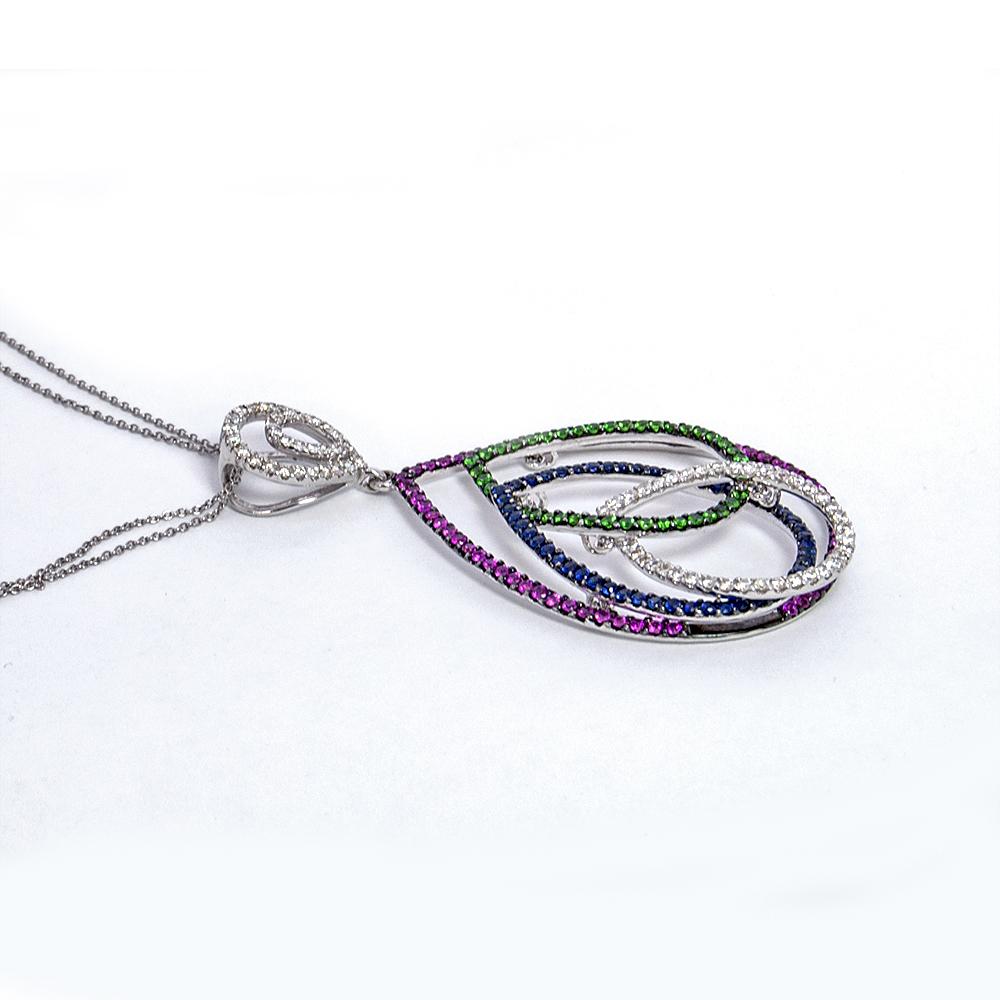 Lovely and colorful pendant necklace. It features four interlocking pear shaped hoops of diamonds, blue and pink sapphires and tsavorites. It has 1.10 carats of white diamonds, 2.65 carats of blue and pink sapphires and .75 carats of green