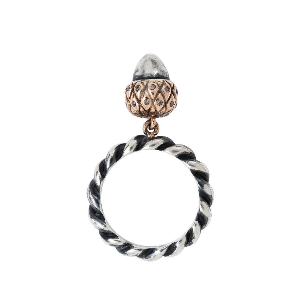Limited edition of silver moving acorn by Sylvie Corbelin.
The acorn is set with diamond and its top is in 750/1000 (18K) rose gold.
The mount of the ring is in patinated silver and twisted.
Total weight of the diamonds  : 0,13 carats
Total weight