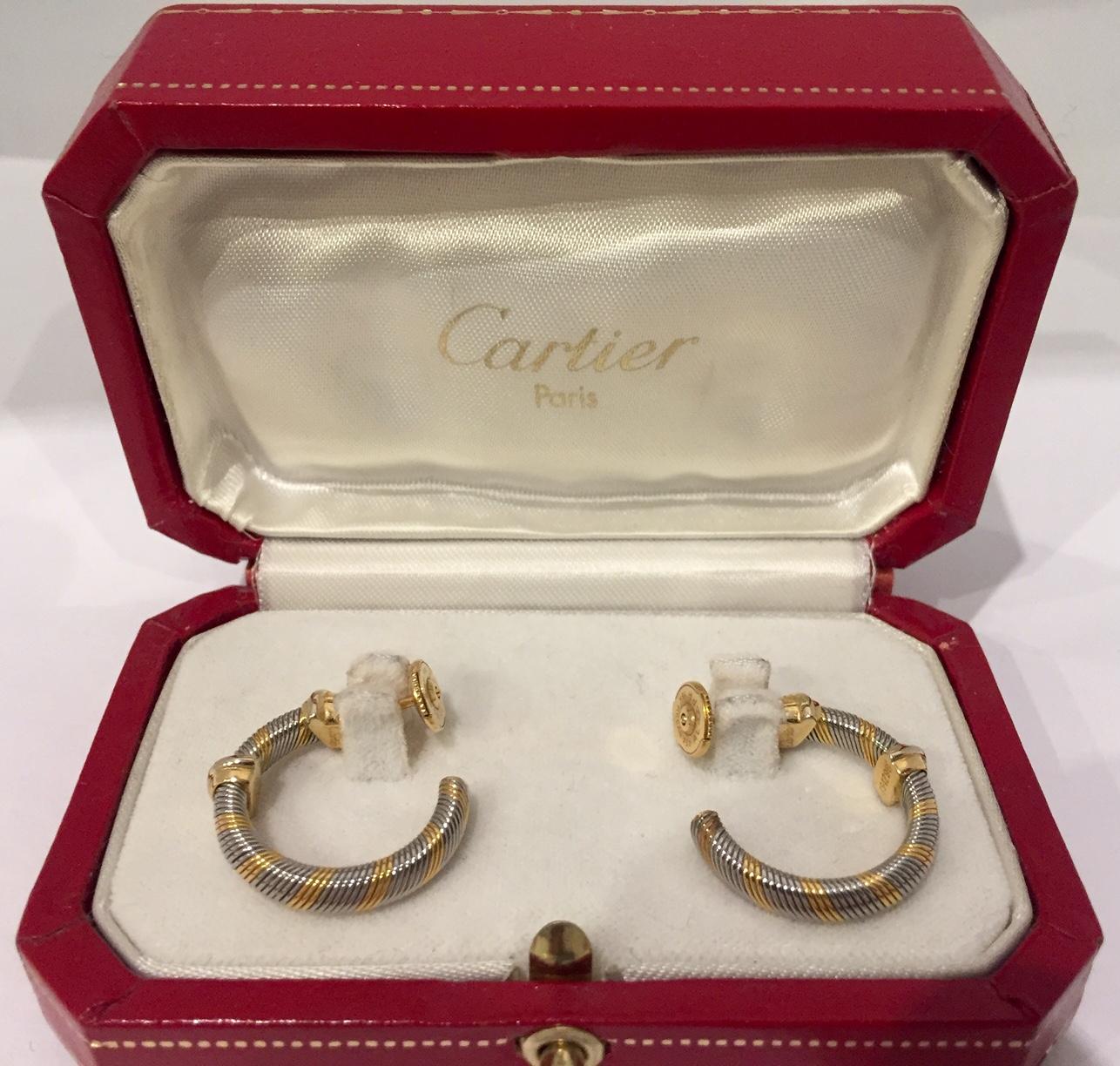 A beautiful pair of vintage 1986 Cartier Hoop Earrings in 18k yellow gold & steel.
In incredible condition, these earrings would make a very stylish addition to any collection
Stamped Cartier 754296 or 750.
Diameter 20mm; weight 10.3 grams.