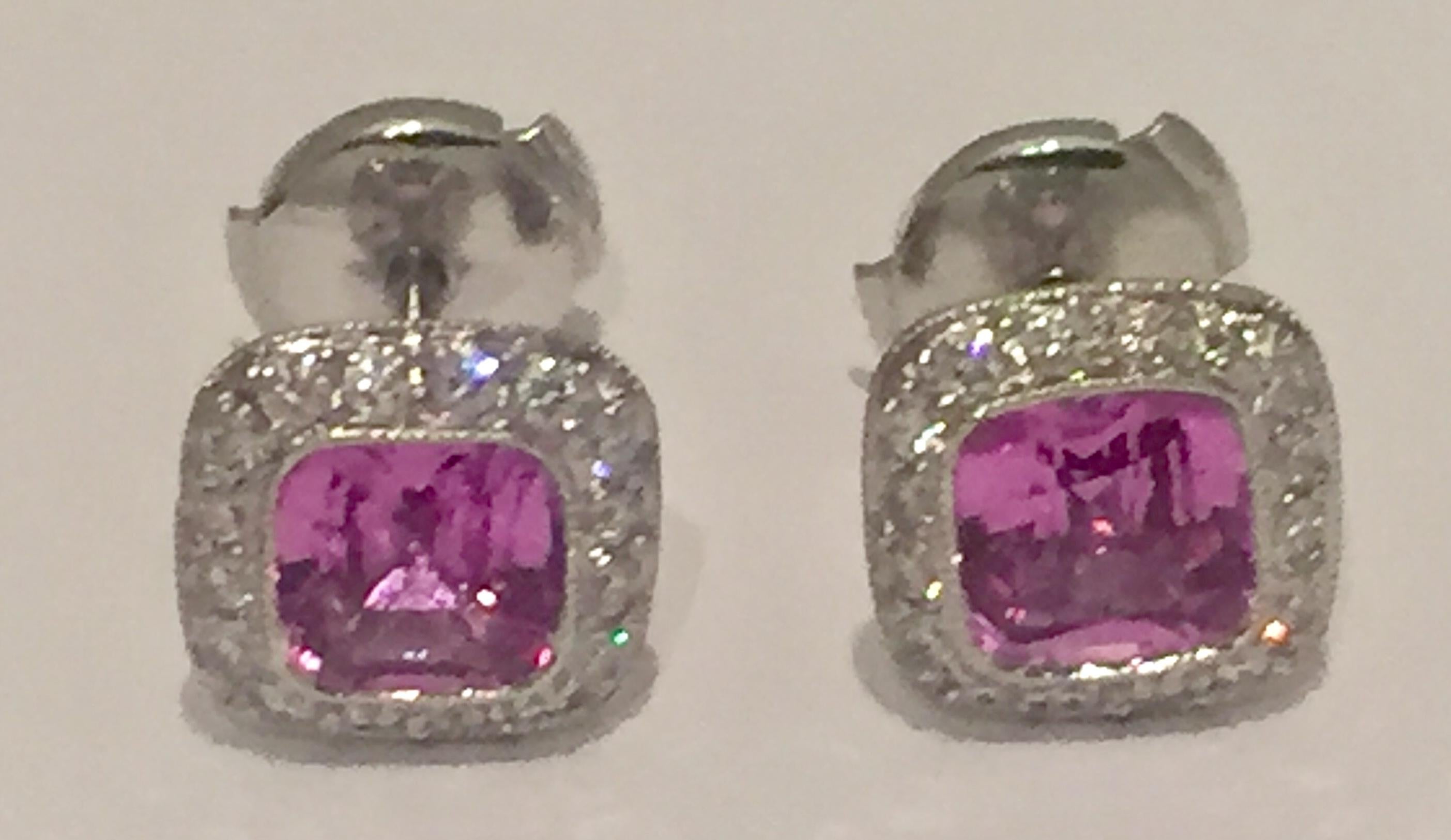 Here is a pair of fine Tiffany & Co Platinum Pink Sapphire and Diamond earstuds from the Legacy collection. Made from solid Platinum 950. It holds 2 cushion cut natural Pink Sapphires of 2.76 ct and is surrounded by 16 brilliant cut diamonds of 0.46