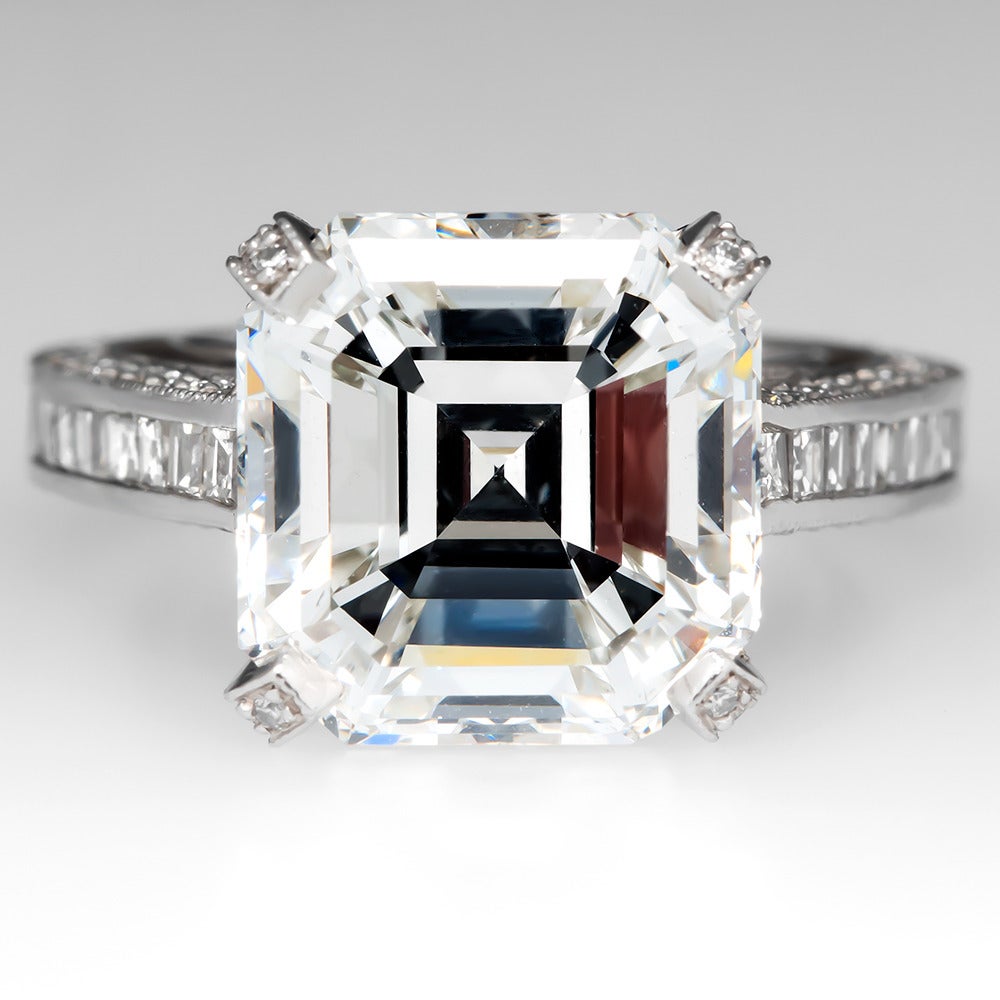 This magnificent GIA 7 Carat Asscher Cut Diamond engagement ring is beyond words. The GIA certified diamond grades a spectacular G / SI1 and weighs in at exactly 7.66 carats. The diamond features a very good cut, very good polish, good symmetry, and