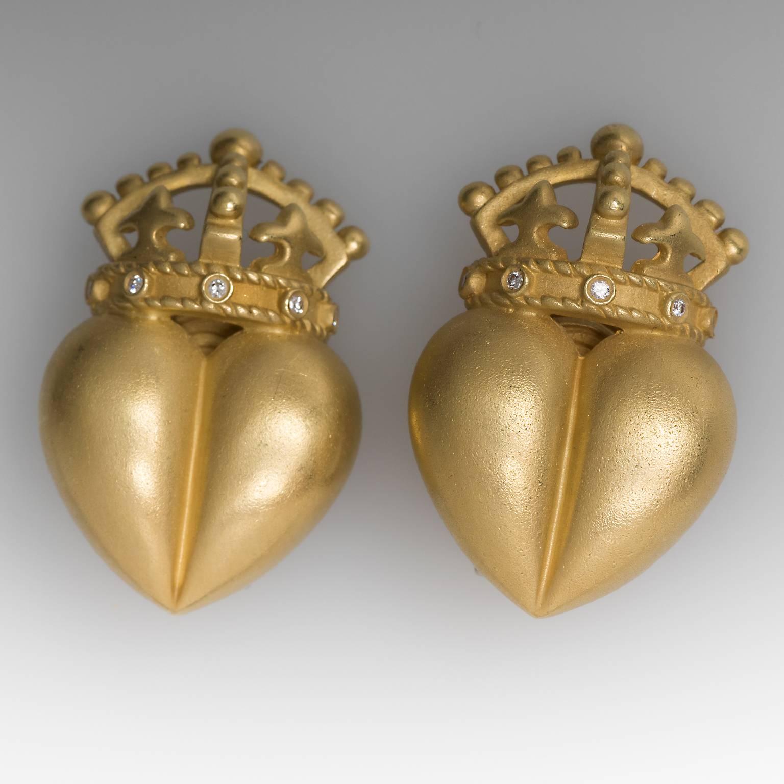 These striking Barry Kieselstein Cord crown heart earrings are crafted of solid 18k gold. They feature genuine diamond accents and are in like new condition. The earrings are currently clip on but can have a post added. The earrings are date stamped