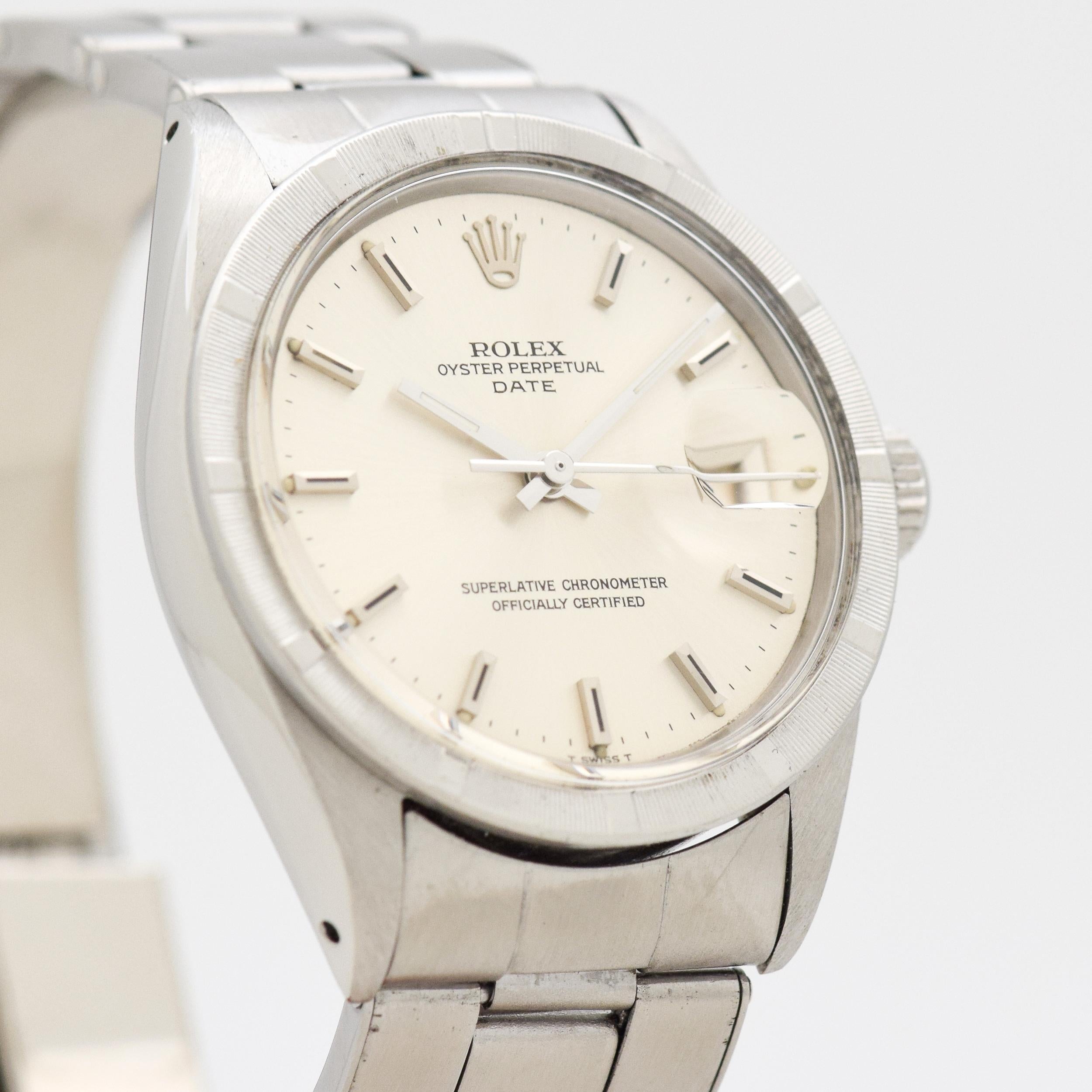 1969 Vintage Rolex Date Automatic Ref. 1501 Stainless Steel watch with Original Silver Dial with Applied Steel Stick/Bar/Baton Dial with Original Rolex Stainless Steel Oyster Bracelet. 35mm x 40mm lug to lug (1.38 in. x 1.57 in.). 26 jewel,