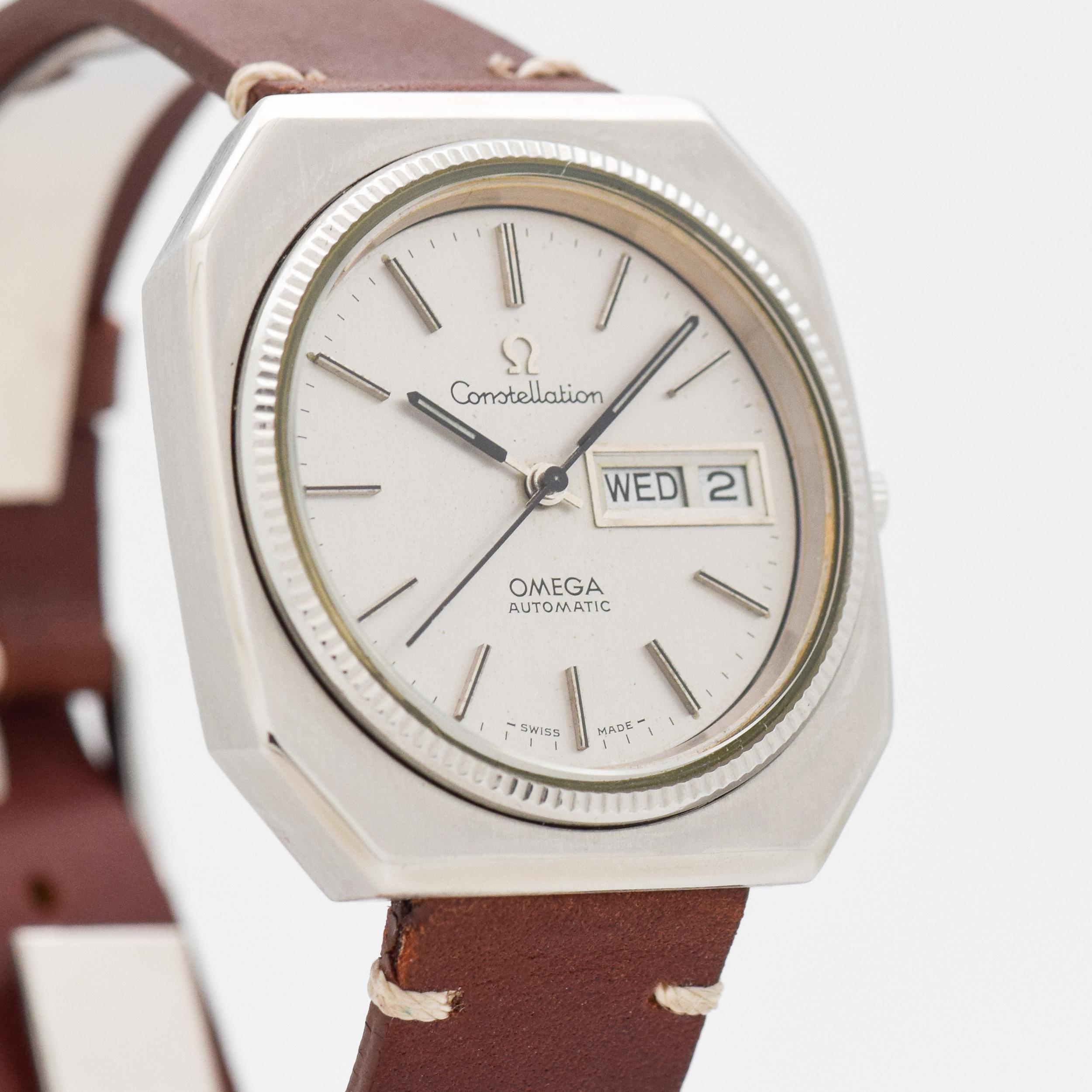 1975 Vintage Omega Automatic Day-Date Constellation Stainless Steel watch with Original Silver Dial with Applied Steel Stick/Bar/Baton Markers. 36mm x 38mm lug to lug (1.42 in. x 1.5 in.) 23 jewel, automatic caliber 1022 movement. Triple Signed.