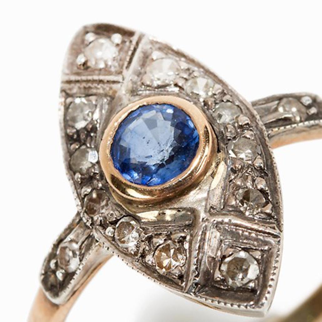 Marquis ring with sapphire and 12 diamonds, around 1920

18 carat gold, 925 silver
France, probably around 1920
1 Sapphire approx. 0.2 ct
12 small diamonds totalling approx. 0.15 ct
hallmark inside 