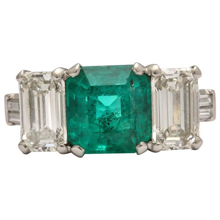 Art Deco Emerald and Diamond 3-Stone Ring Set in Platinum