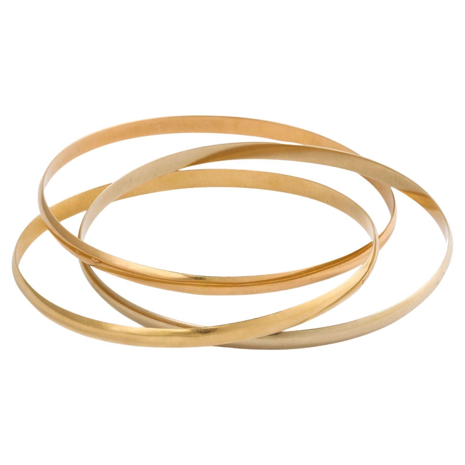 French Rolling Bangles in Tricolor Gold For Sale