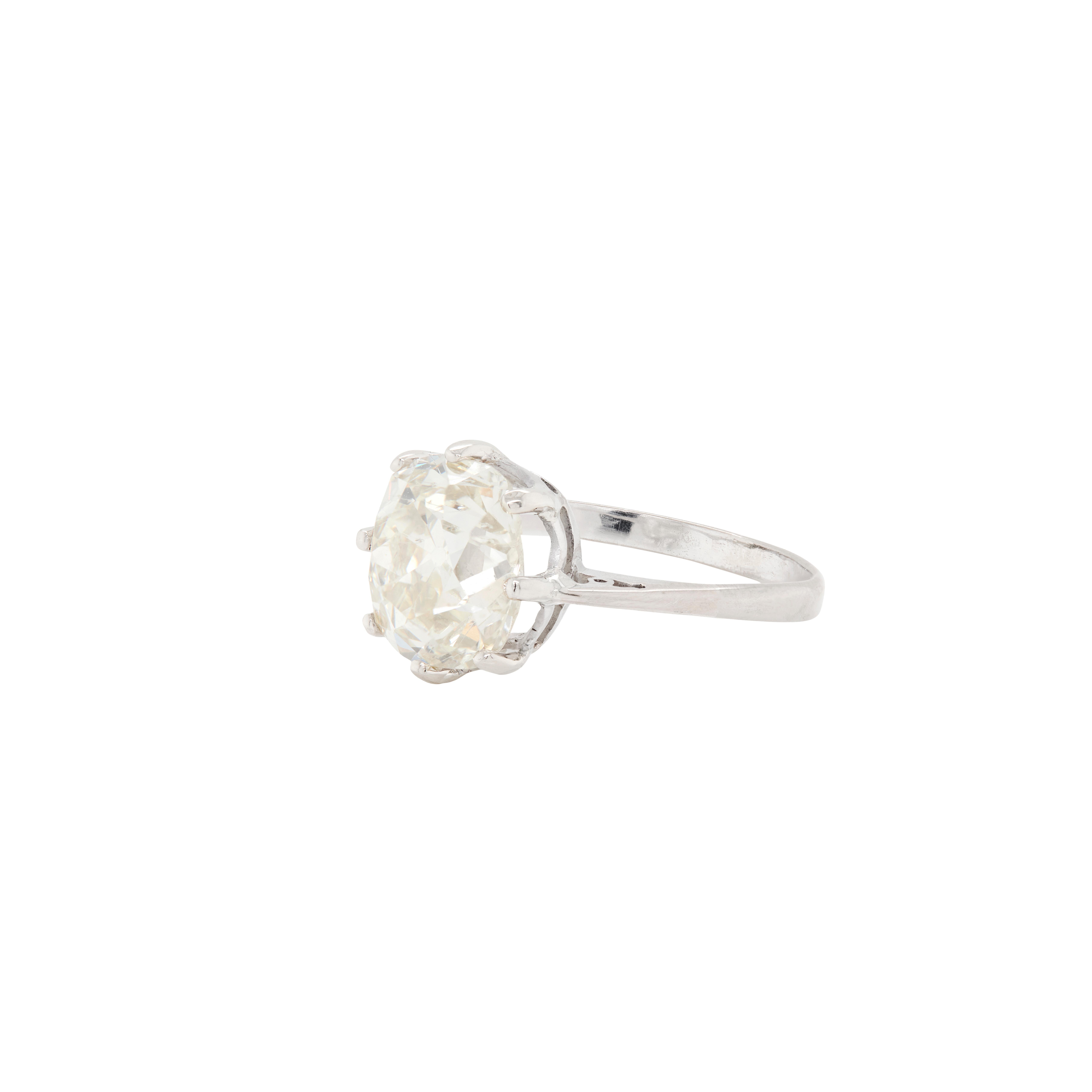 A magnificent antique engagement ring centrally set with a wonderful 3.60ct Victorian old mine cushion cut diamond, in an eight claw, open back collet. The solitaire stone sits proudly atop an elegant 18 carat white gold band with raised openwork