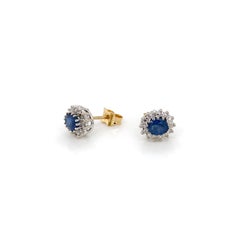 Blue Sapphire and Diamond Halo Oval Stud Earrings in 9 Carat Gold