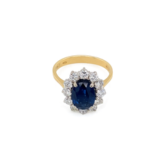 Bague de fiançailles en or blanc et jaune 18 carats, sertie d'un saphir bleu et d'un halo de diamants