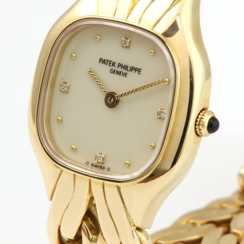 This Patek Philippe 4815/1J Ladies La Flamme watch features a quartz movement with diamond hour markers.  The 