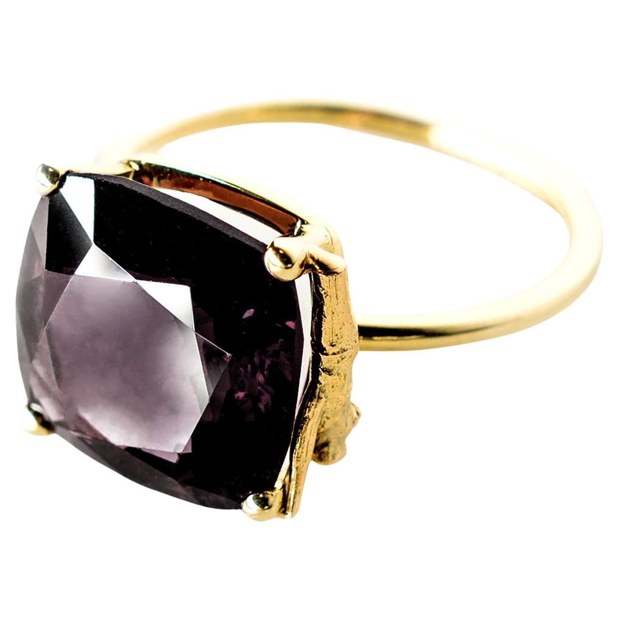 This ring is made of 14-karat rose gold and features a cushion storm color spinel. The size of the ring can be customized to fit you perfectly.

Additionally, the ring can be ordered in 18-karat yellow, rose, or white gold with spinels in other