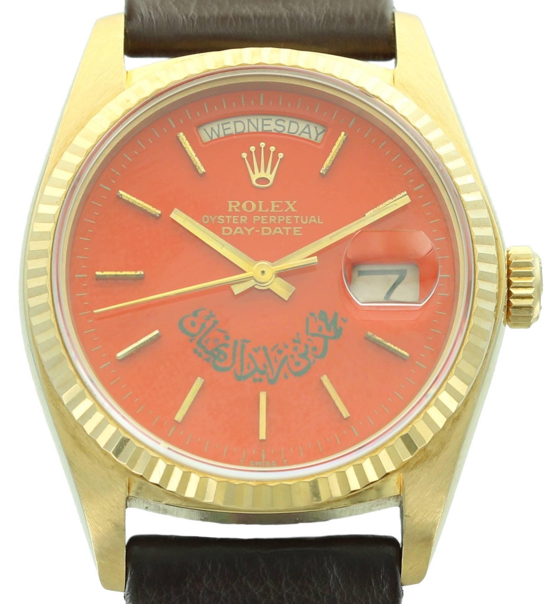 This extremely rare Rolex Day-Date, ref. 18038 features one of the most unusual dials we have ever seen. It is a rich, reddish-orange Stella dial with writing that we have translated to be the name of the Mohammed Bin Zayed Al Nahyan, the crown
