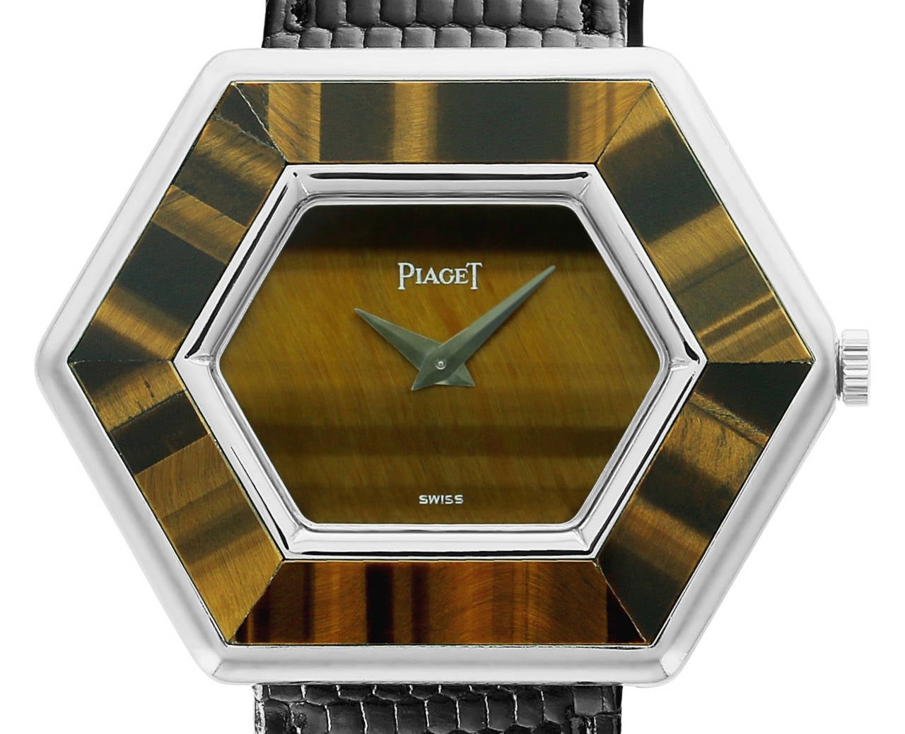 This beautiful, vintage, hexagonal Piaget ladies watch features white gold with Tiger's Eye inlayed bezel and dial. Tiger's Eye is a beautiful gemstone that is a metamorphic rock with beautiful shades of dark brown and gold coloring. This is an