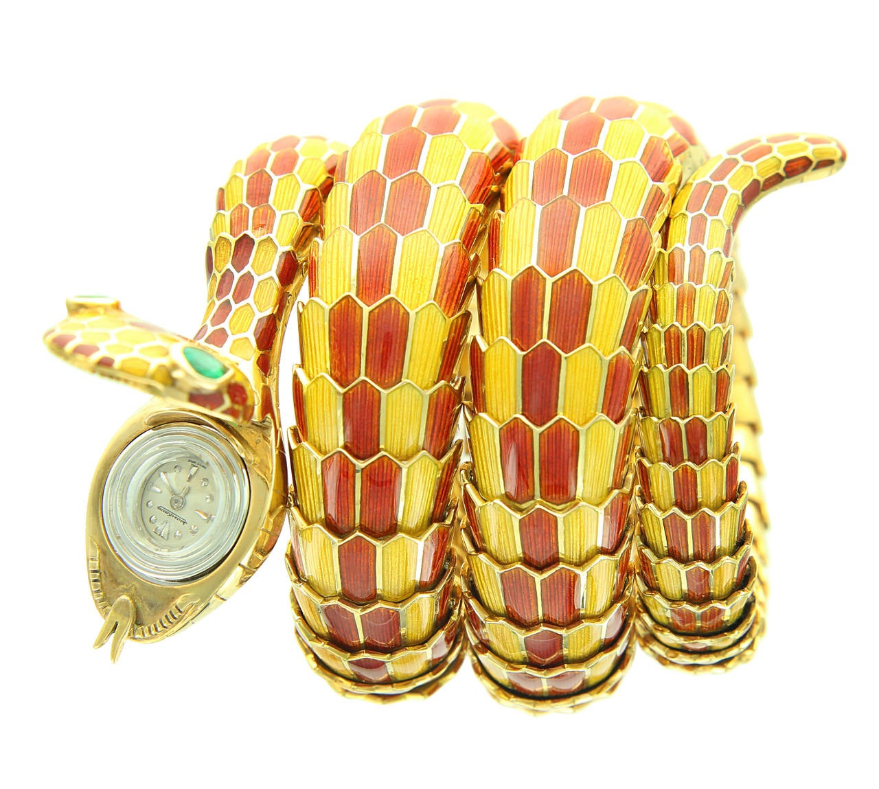 This is a truly spectacular example of the Bulgari Serpenti model. A triple coiled enamel snake with rich orange and yellow scales come to a head featuring emerald eyes and a Jaeger-LeCoultre watch inside the mouth. The head is stamped 