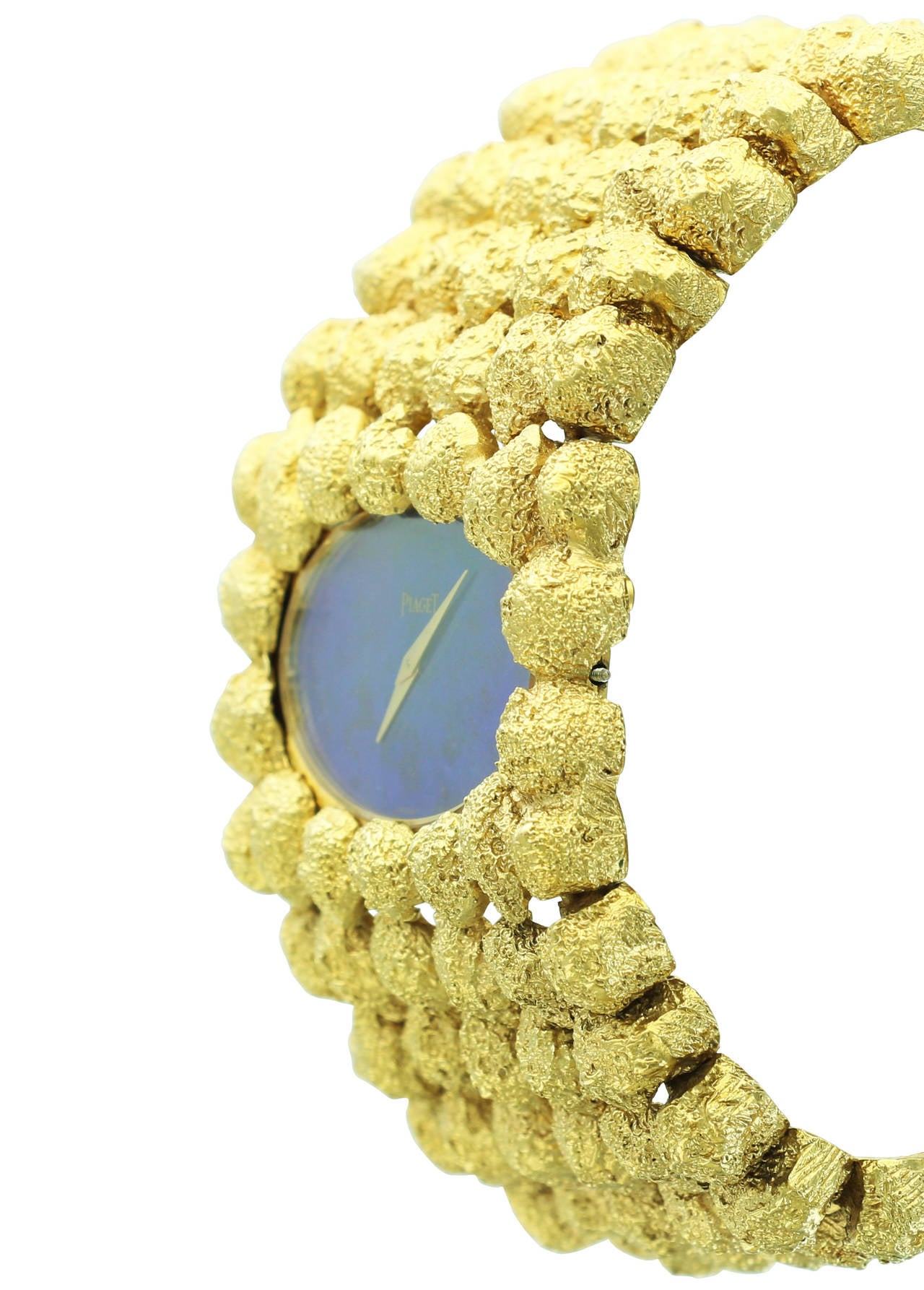 This beautiful Piaget ladies wristwatch features a heavy, solid yellow gold bracelet and vibrant lapis dial.