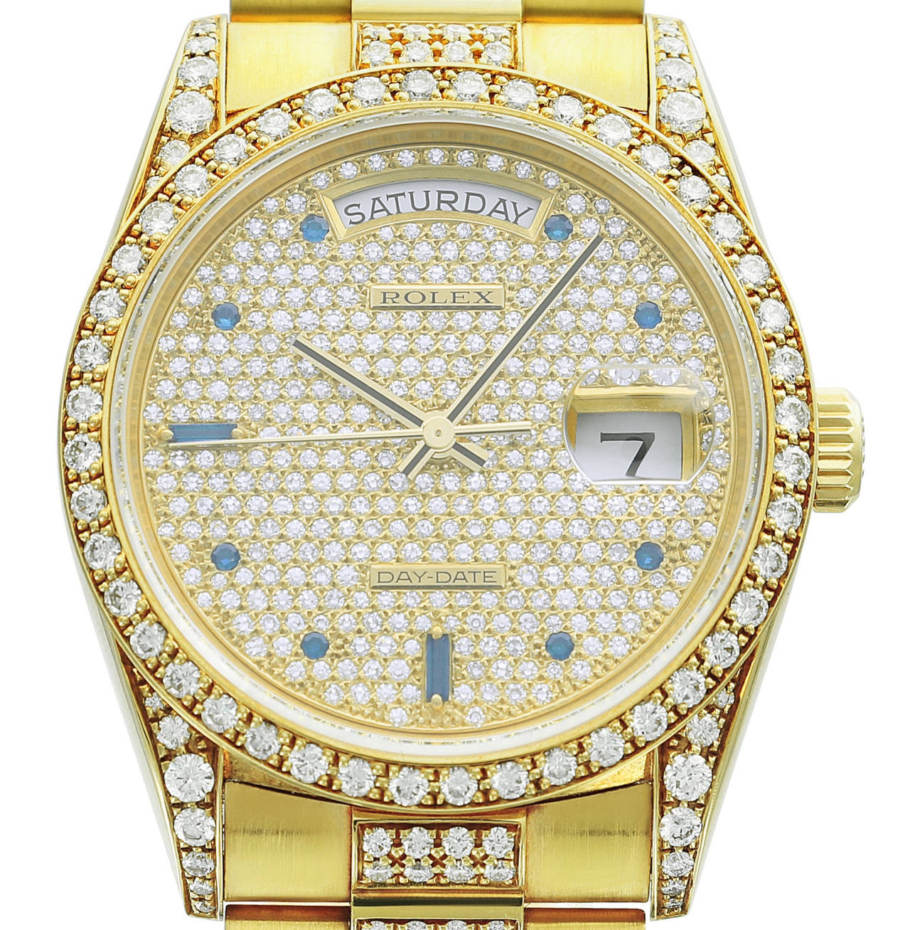 This rare Rolex Day-Date features an original pavé diamond and sapphire dial, diamond bezel and diamond and yellow gold bracelet. Every piece of this beautiful Day-Date is an original, 