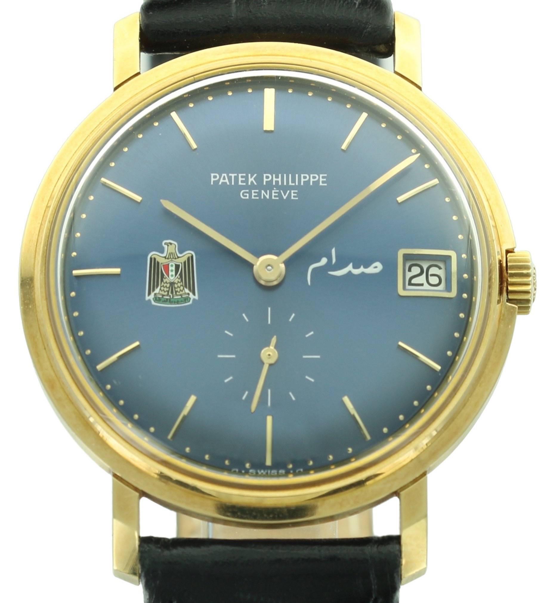 An extremely rare Patek Philippe Calatrava, ref. 3445J with a dial featuring the coat of arms of Iraq. The deep blue dial and yellow gold case make for a beautiful, rich color combo. 
